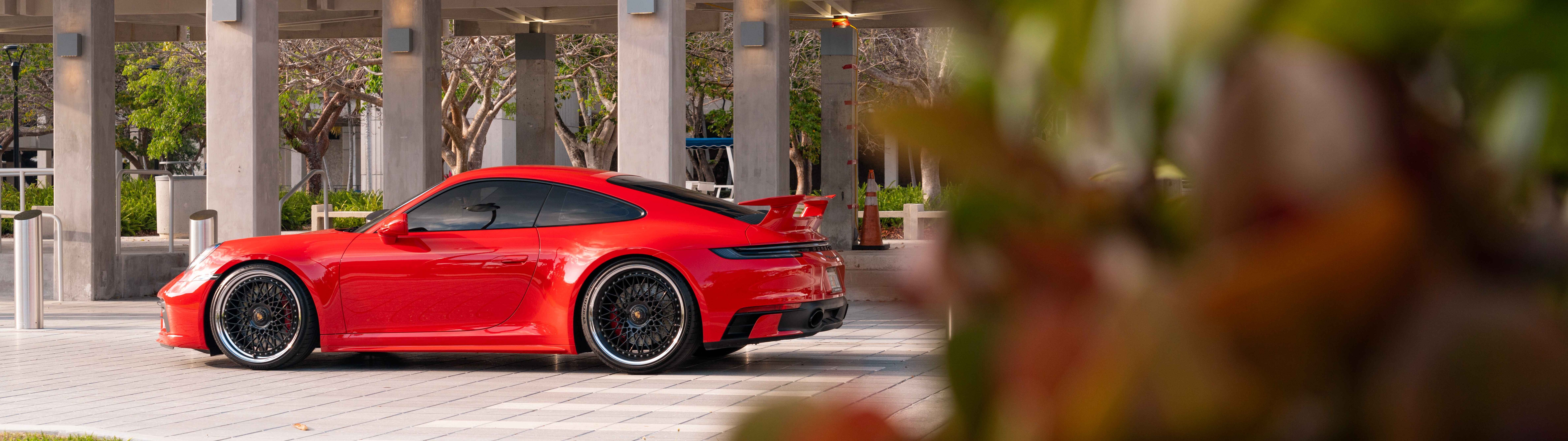 A sleek and modern Porsche 992 GTS sports car featuring aerodynamic design and aggressive styling.