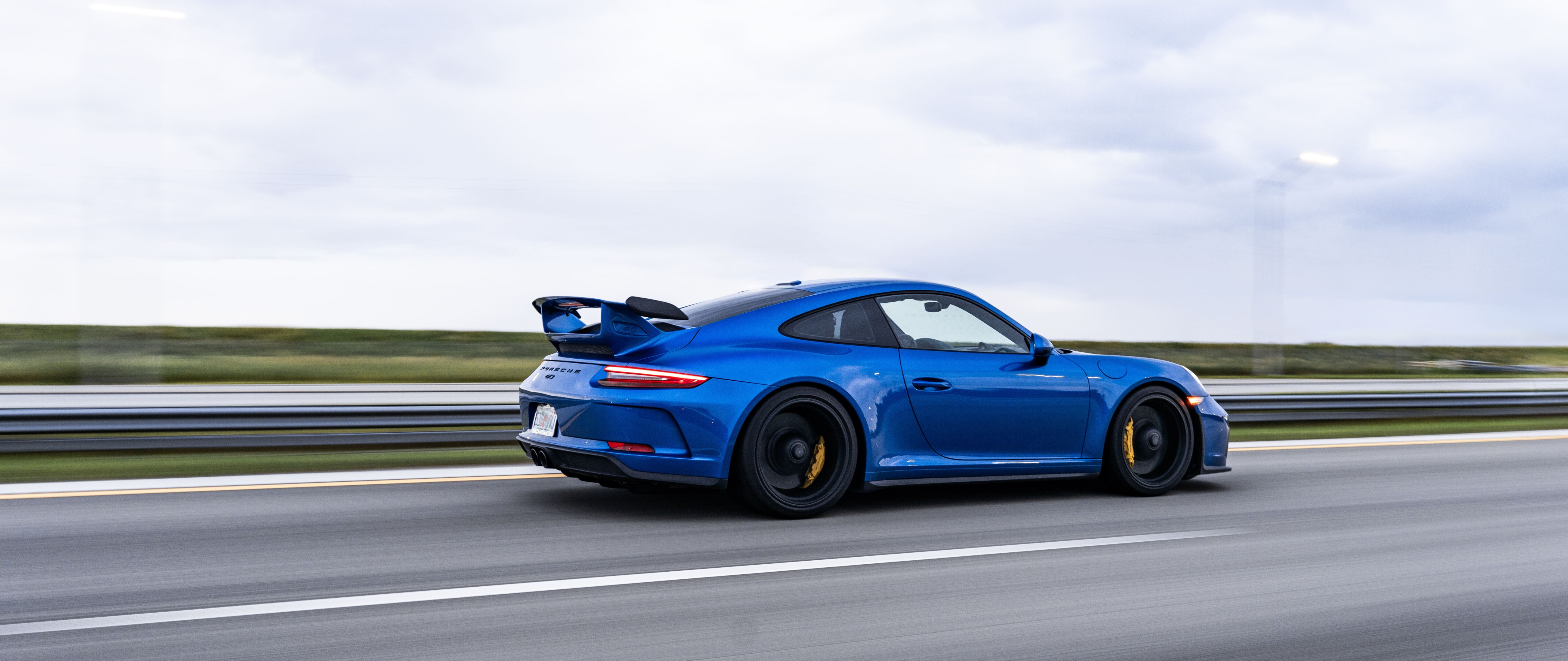 A high-performance Porsche GT3 RS sports car featuring aerodynamic racing elements.