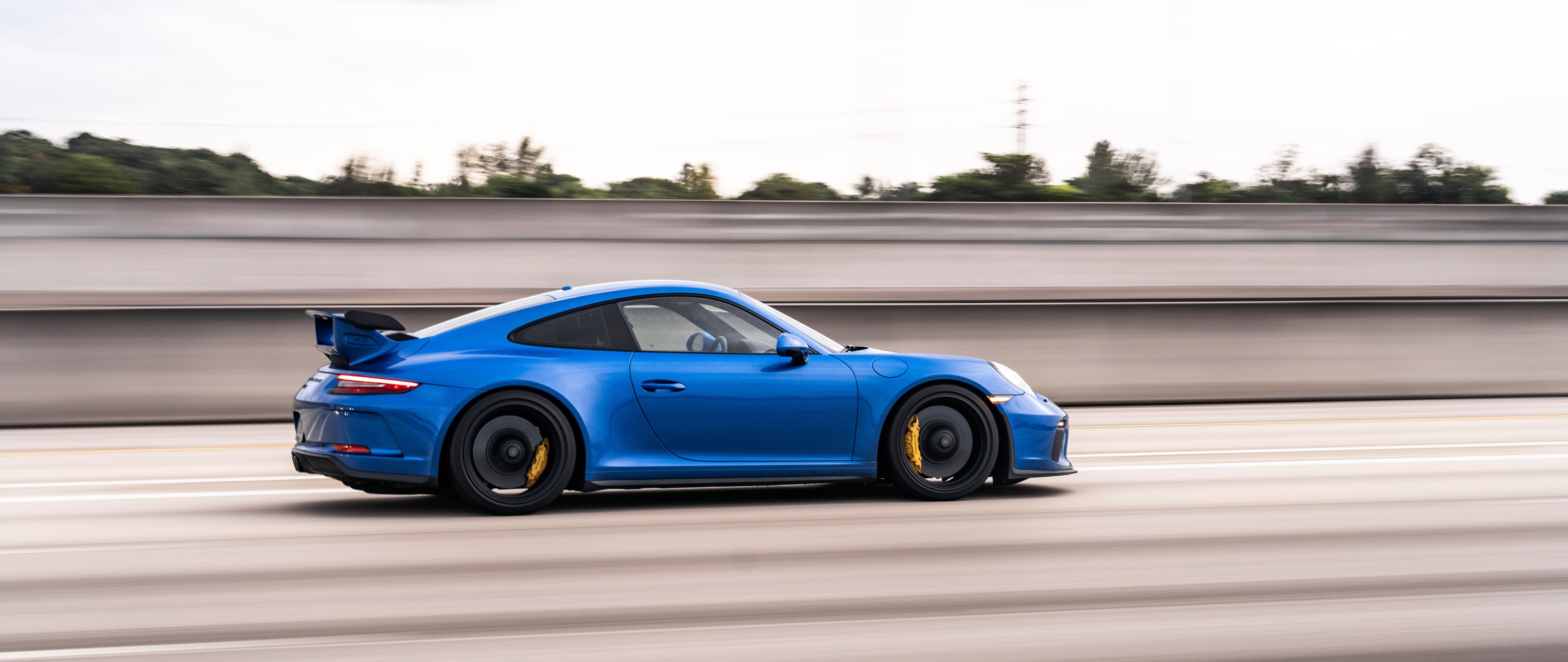 A high-performance Porsche GT3 RS sports car featuring aggressive aerodynamic styling.