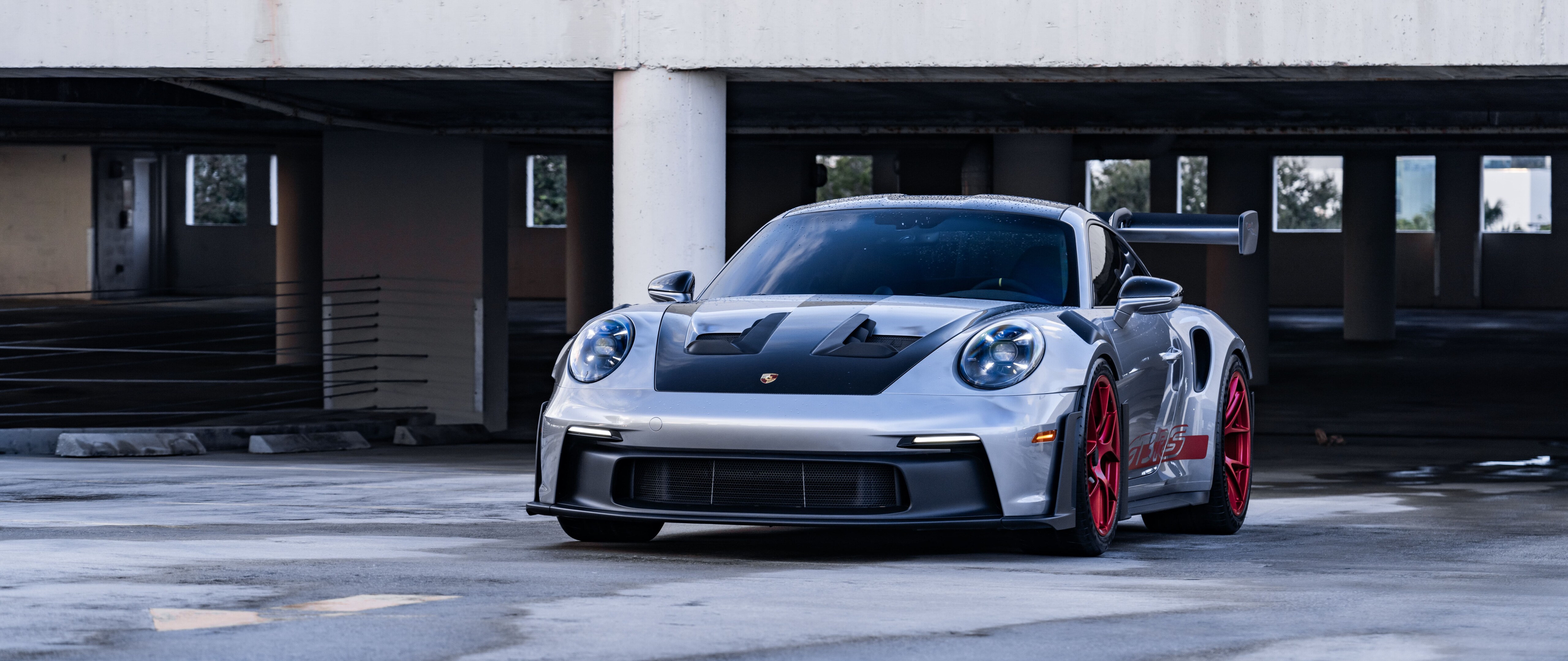 A sleek and powerful Porsche GT3 RS showcasing its aerodynamic contours and iconic design.