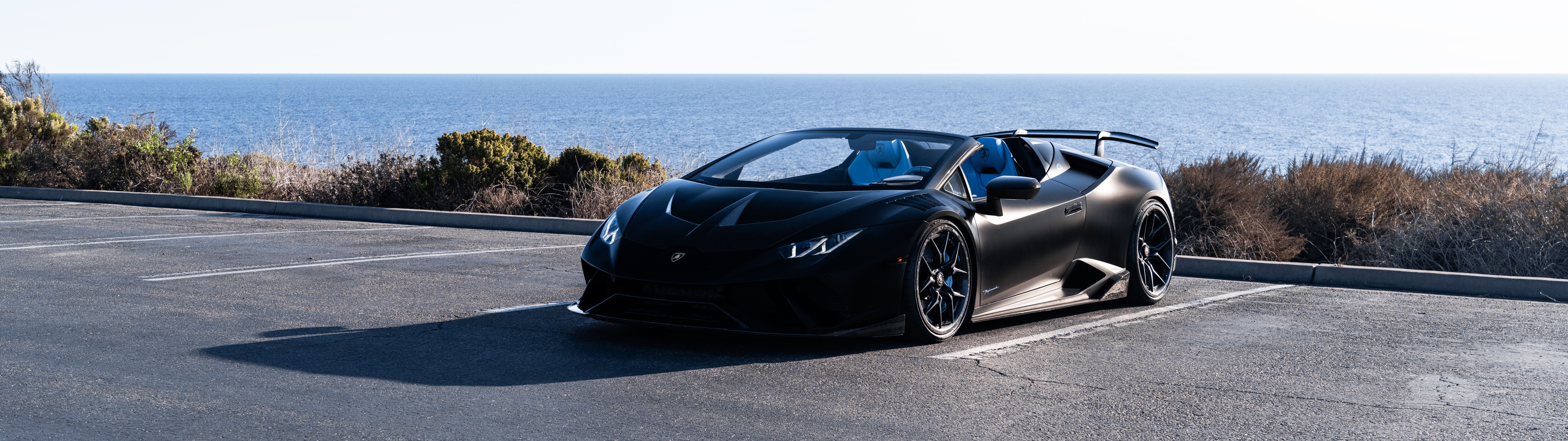 A high-performance Lamborghini Huracán supercar captured in a dynamic pose.