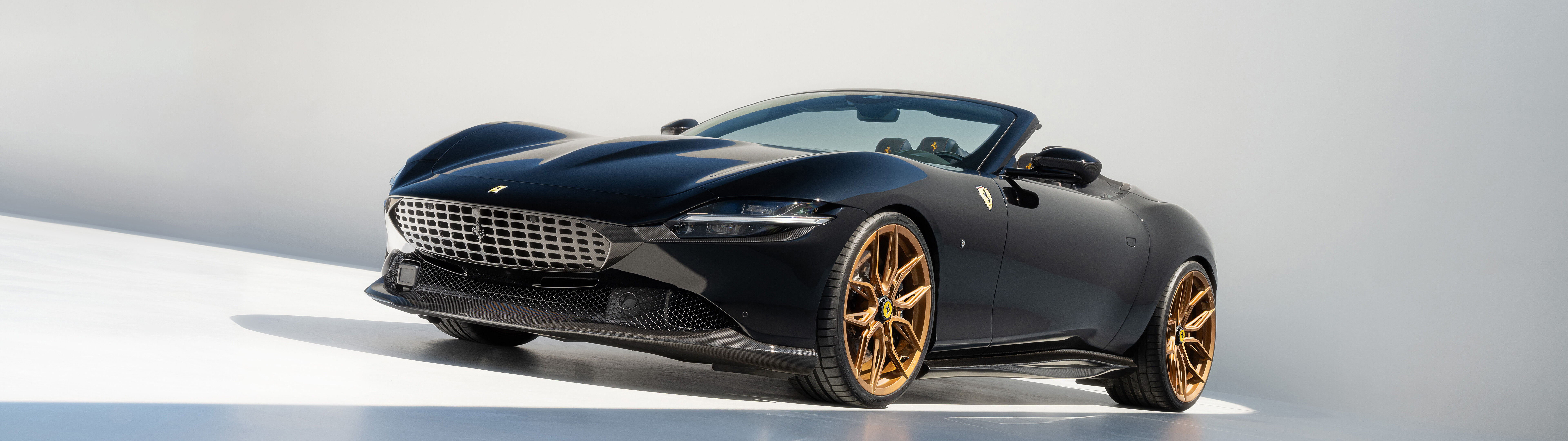 A sleek and polished Ferrari Roma luxury sports car highlighting its aerodynamic curves and premium finish.