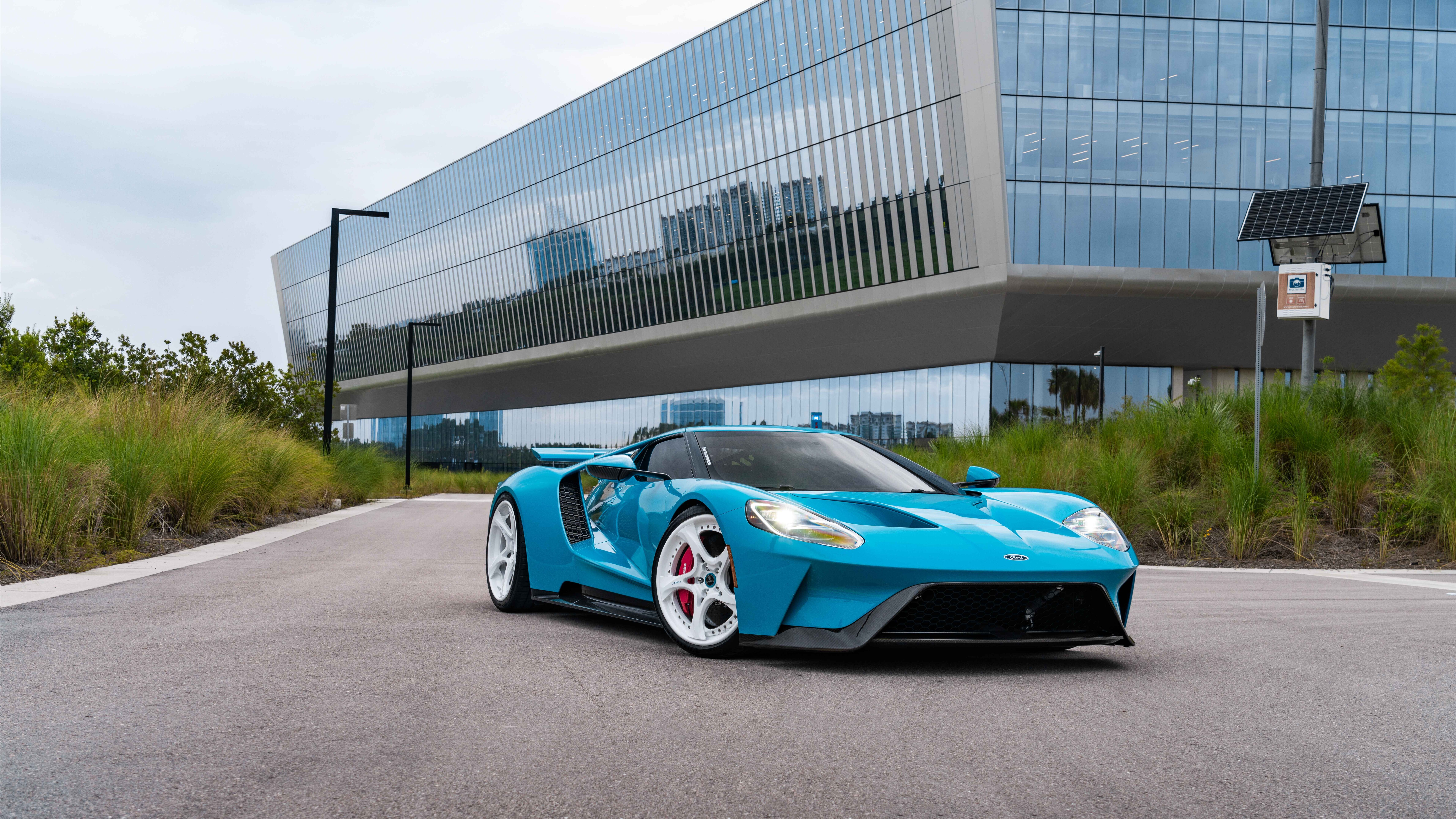 A high-performance Ford GT supercar featuring its signature aerodynamic body and sleek contours.