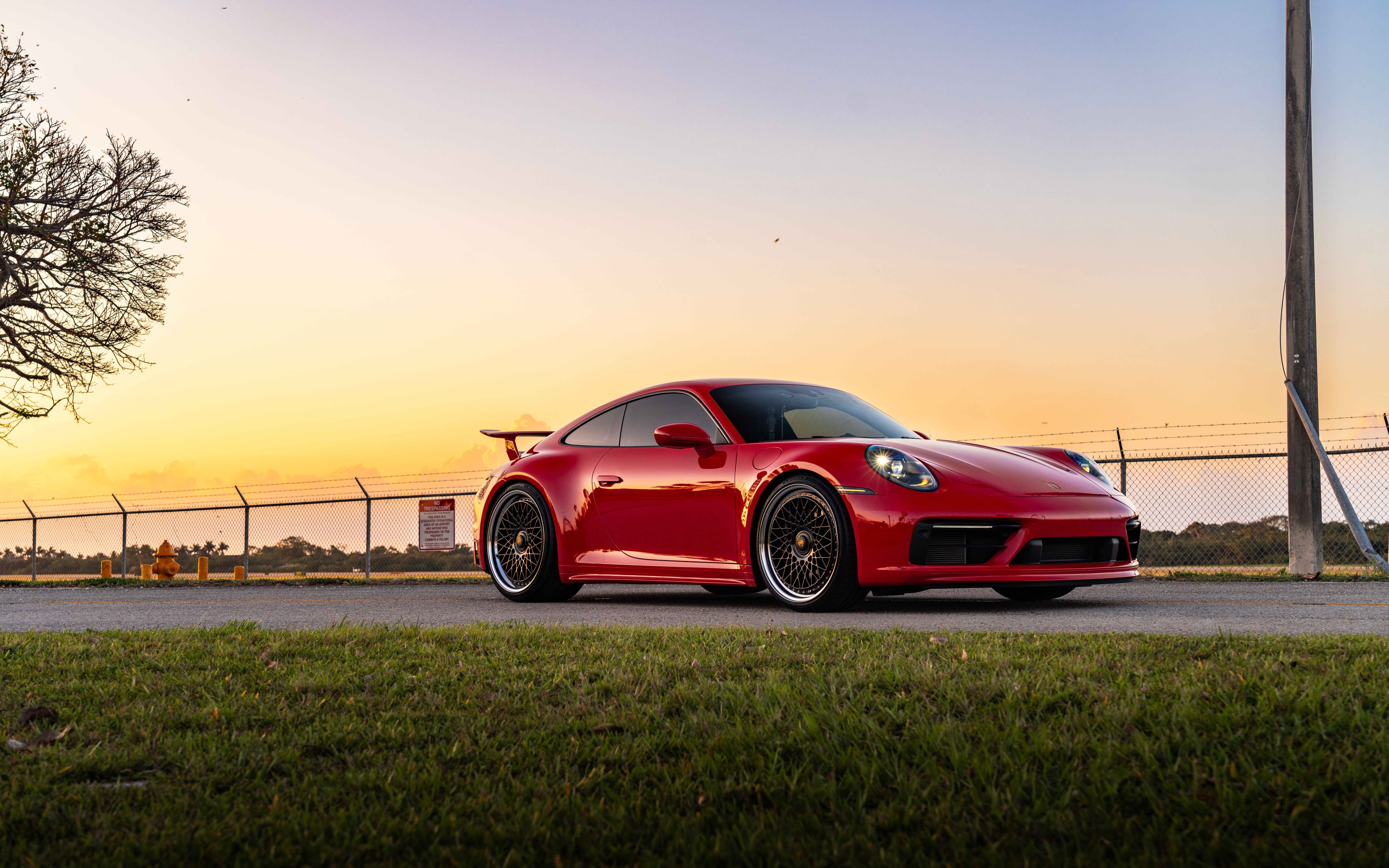 A sleek and powerful Porsche 992 GTS sports car showcasing its modern aerodynamic design.
