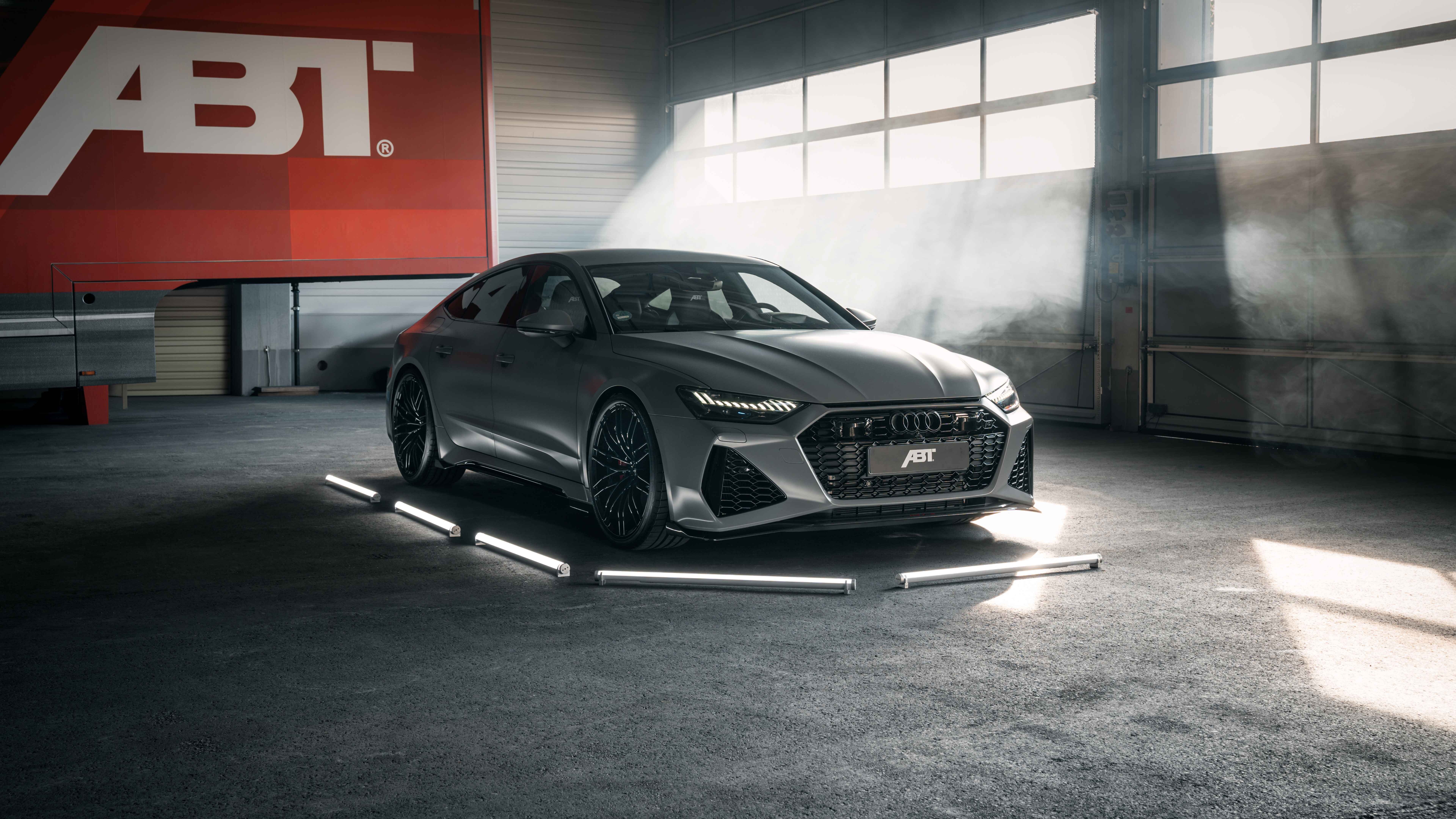 A high-performance Audi RS7 luxury sports car featuring a sleek, aerodynamic design and metallic paint.