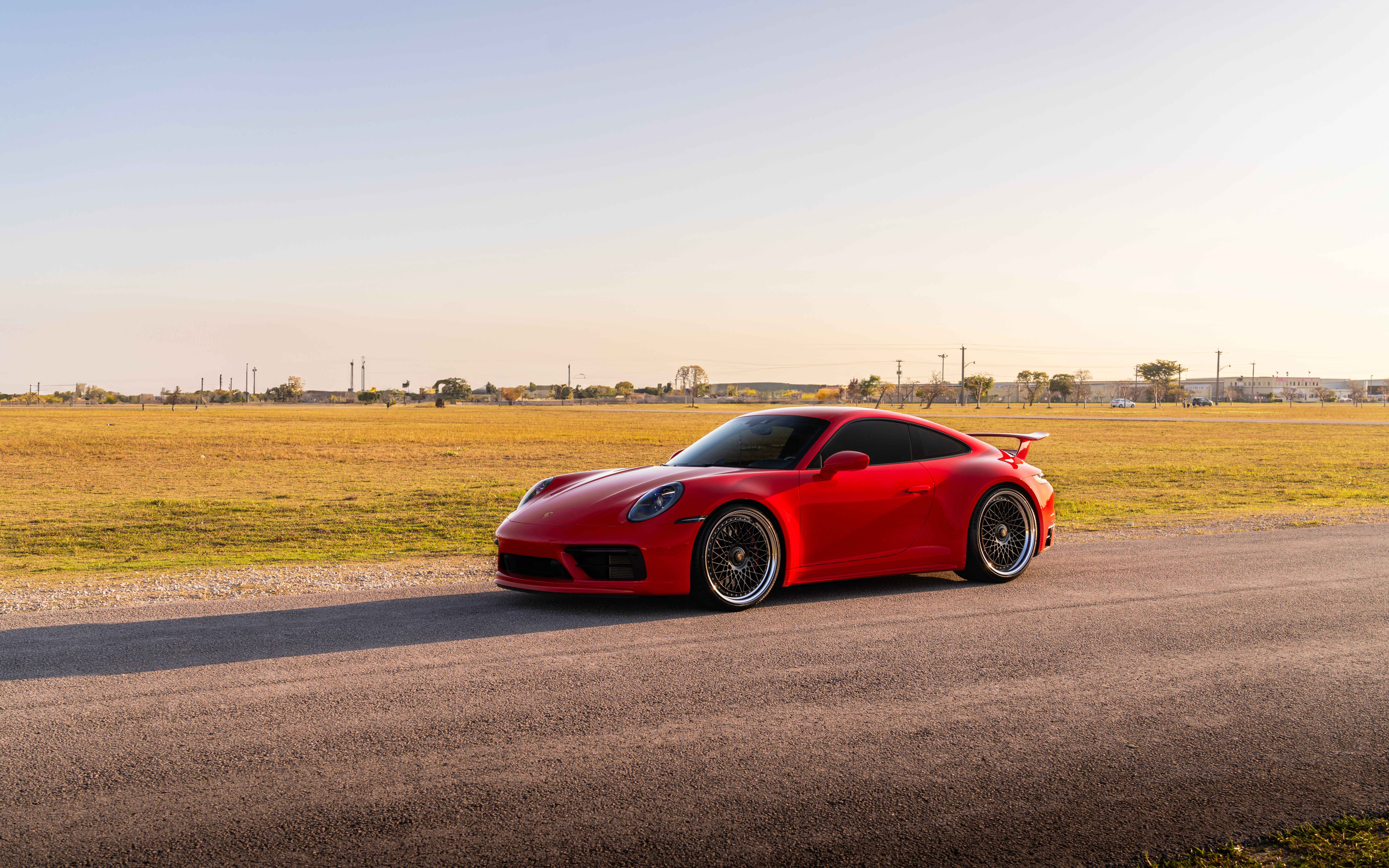 A sleek and powerful Porsche 992 GTS sports car featuring modern aerodynamic design and luxury styling.