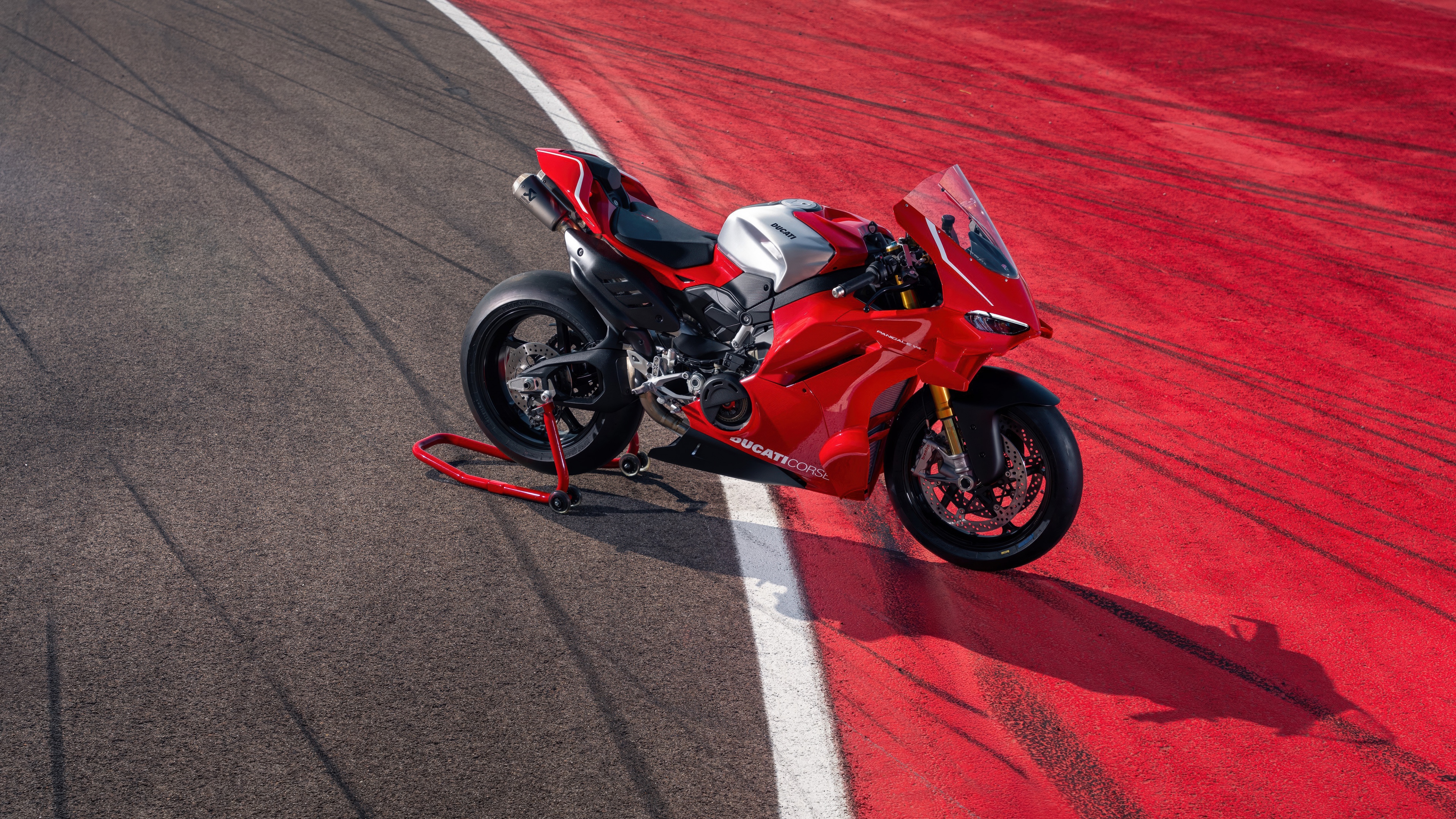 A high-detail 5K shot of a vibrant red Ducati Panigale V4 R sports motorcycle.