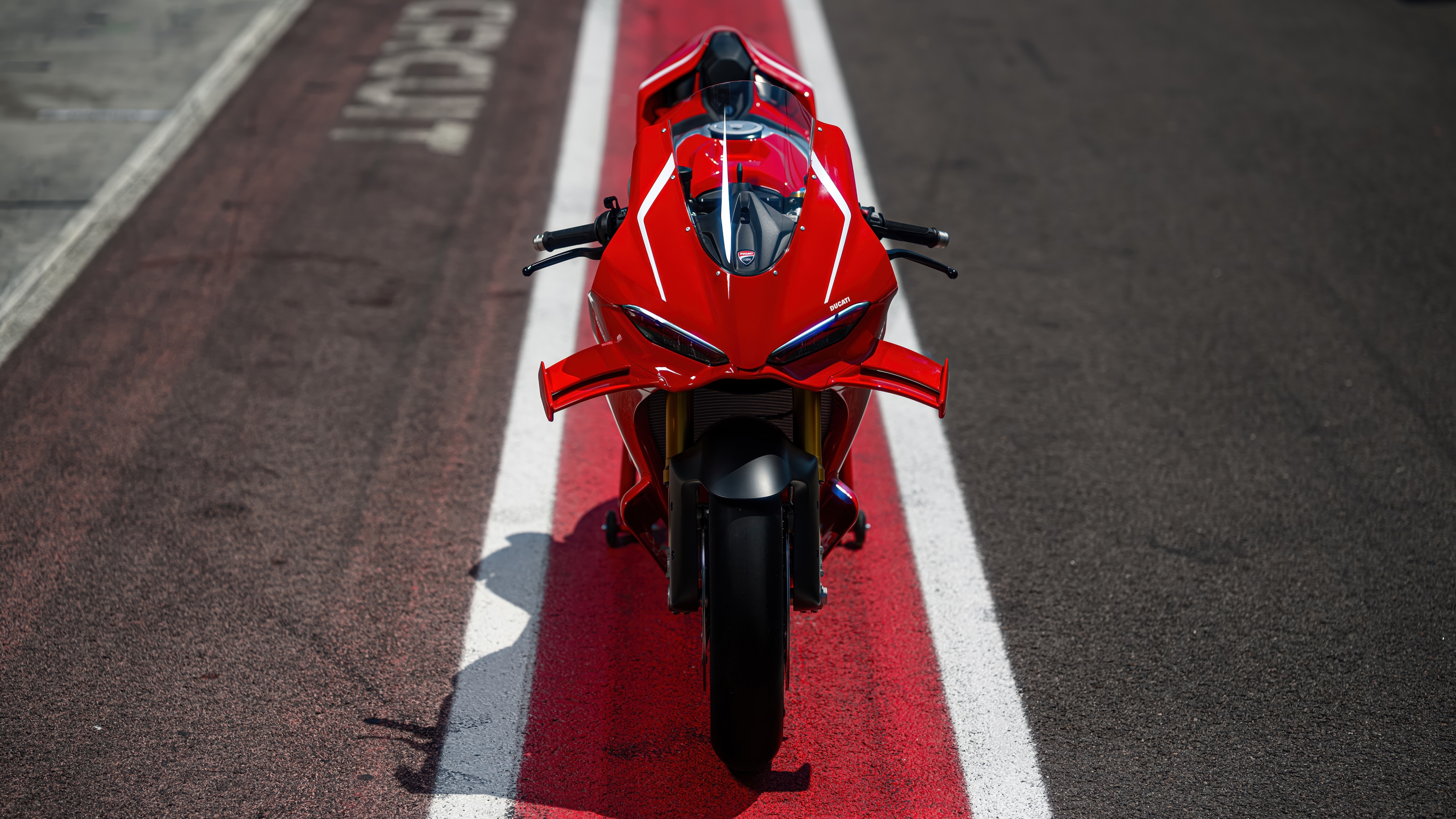 A high-detail close-up of a red 2026 Ducati Panigale V4 R sports motorcycle.