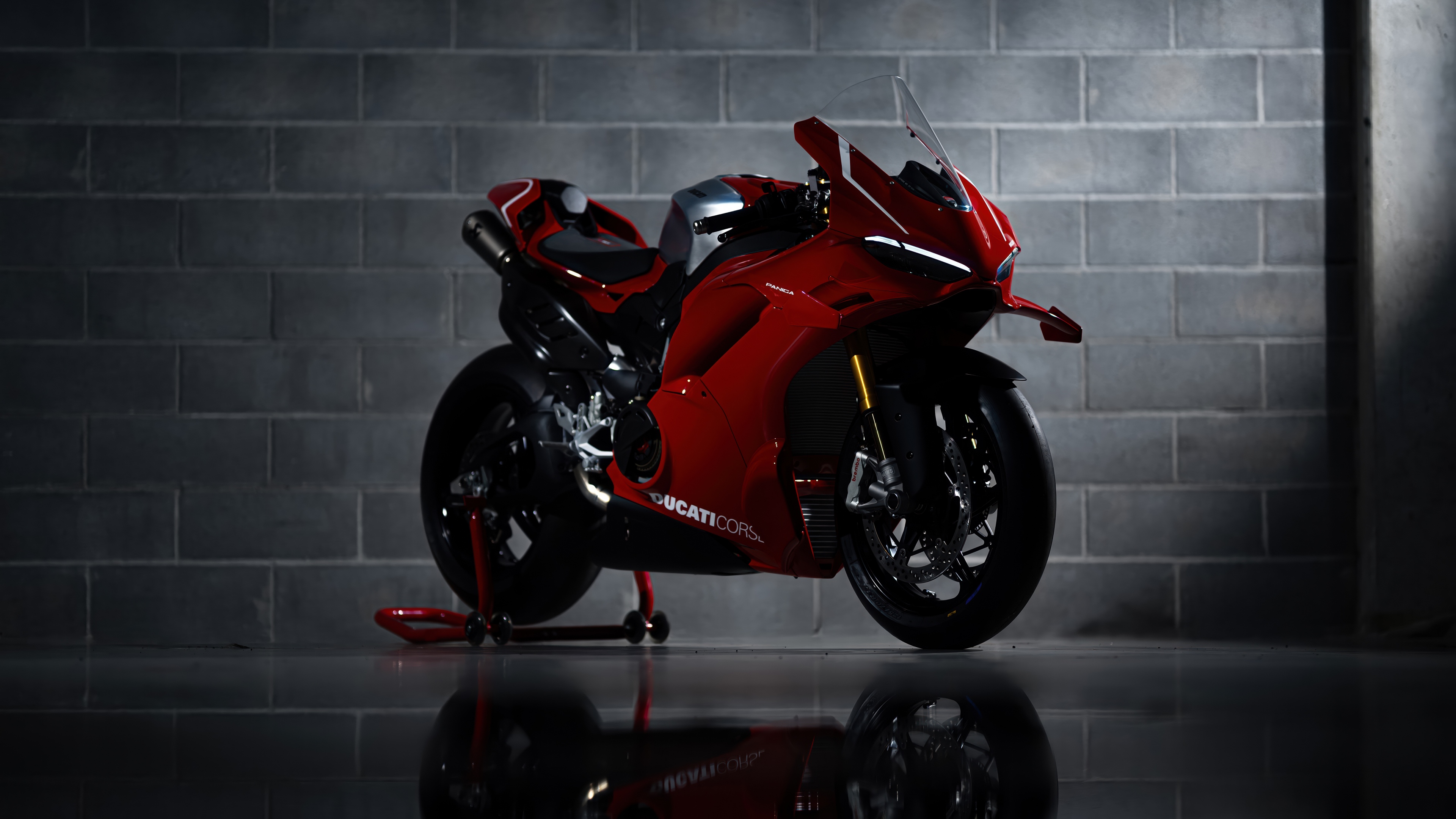 A high-resolution, detailed shot of a sleek red Ducati Panigale V4 R performance sports motorcycle.