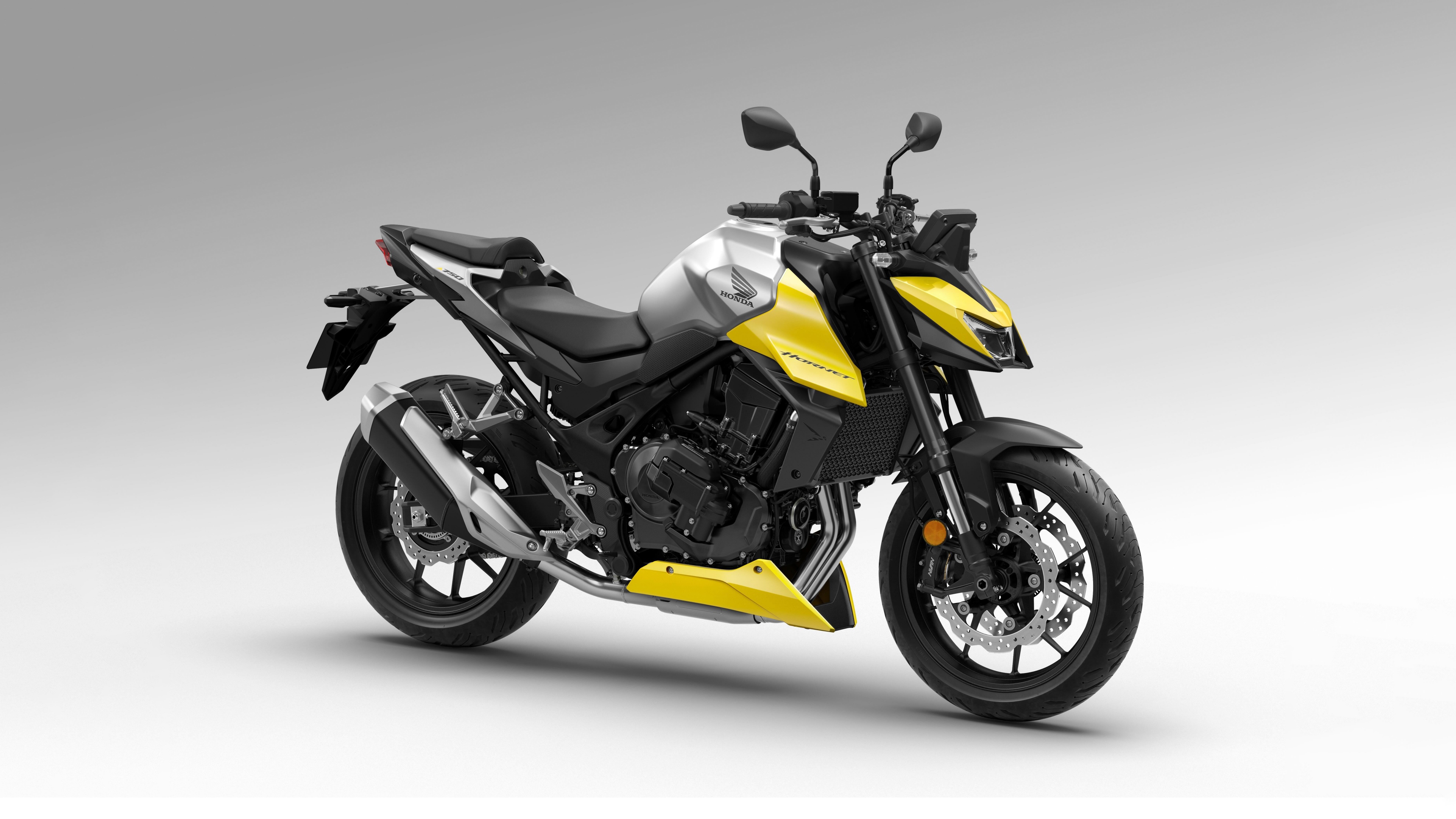 High-resolution close-up of a futuristic 2026 Honda CB750 Hornet motorcycle featuring aggressive streetfighter styling.