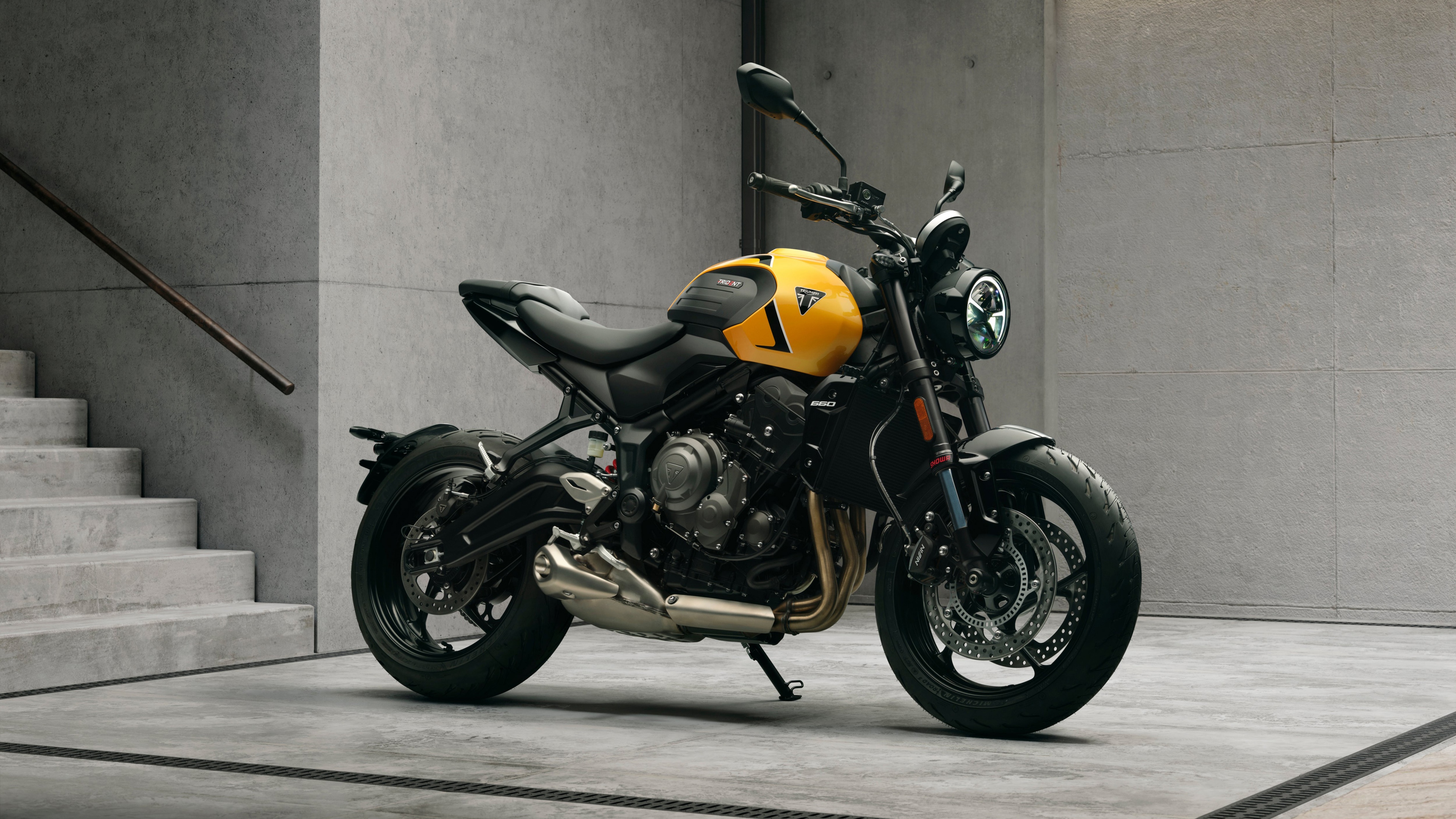 A high-detail shot of the 2026 Triumph Trident 660 naked motorcycle, showcasing its advanced engineering and sleek bodywork.