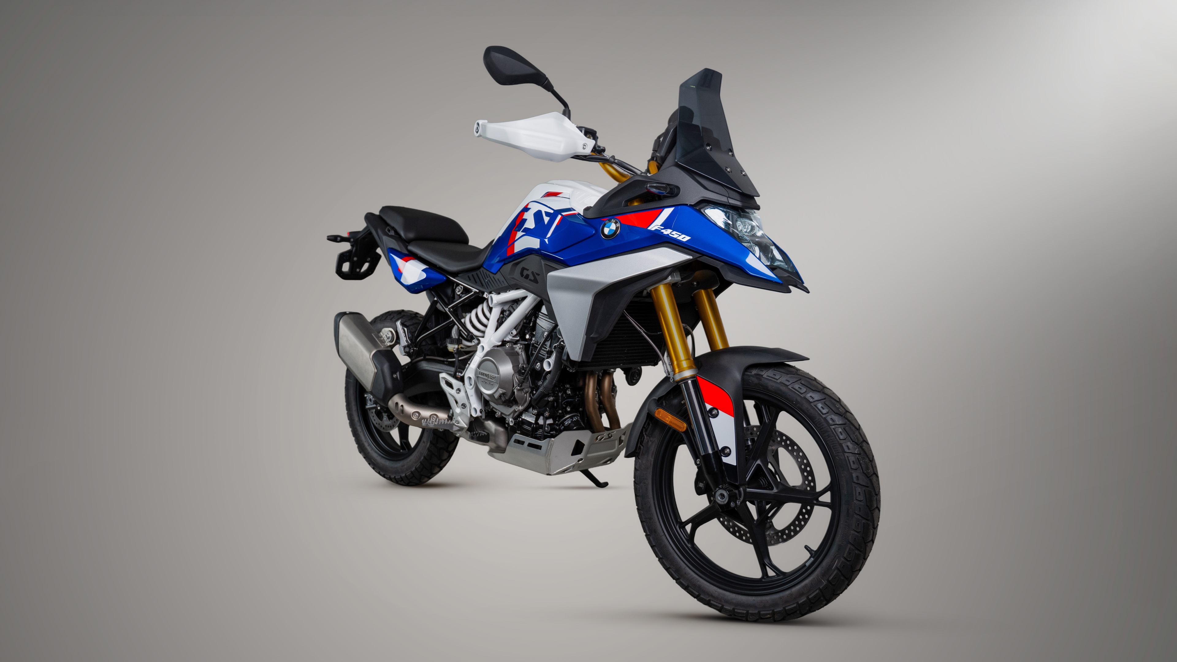 A collection of futuristic and rugged adventure motorcycles on display at the EICMA 2026 exhibition.