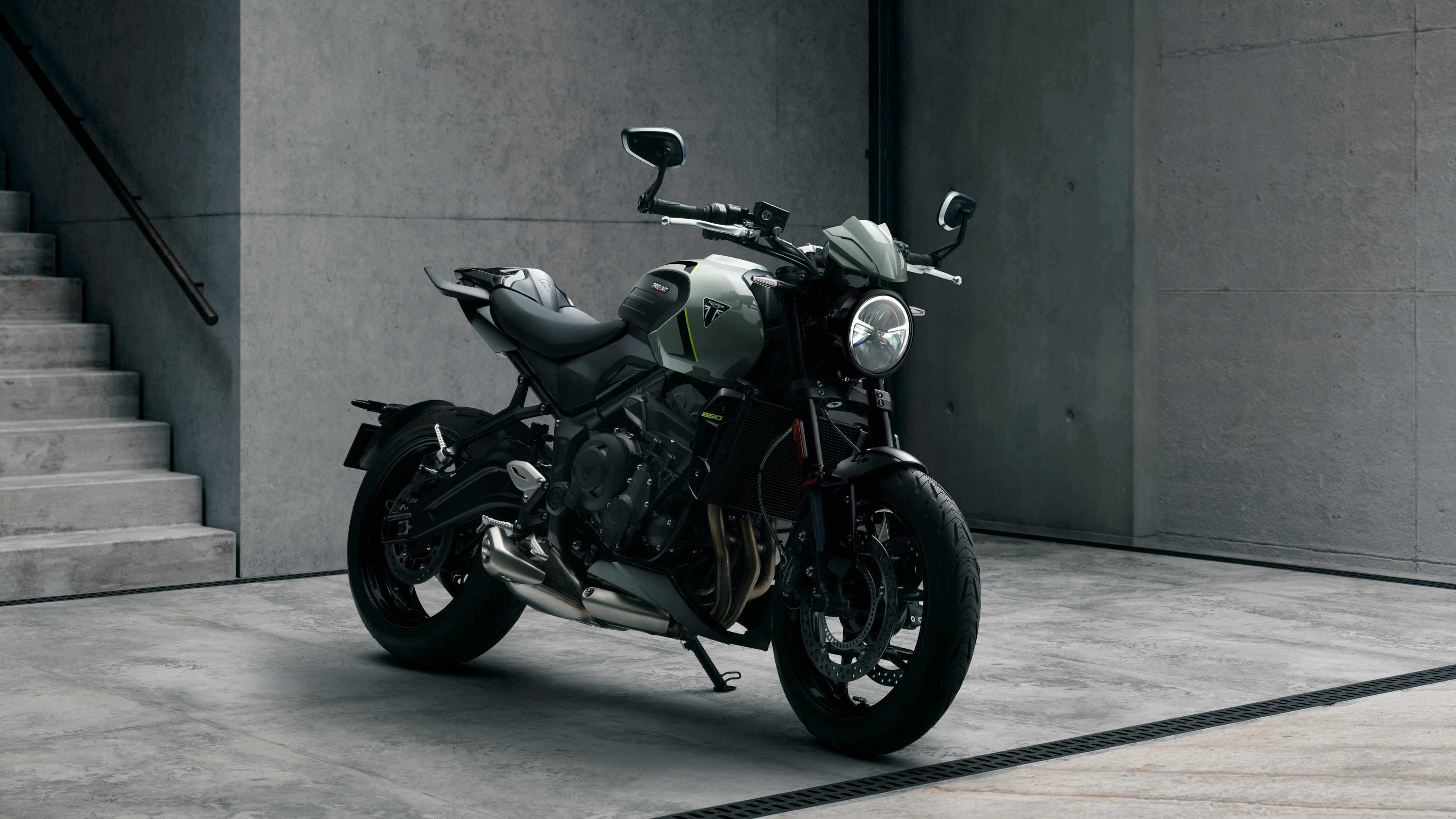 A detailed, high-resolution view of a muscular black Triumph Trident 660 street motorcycle.