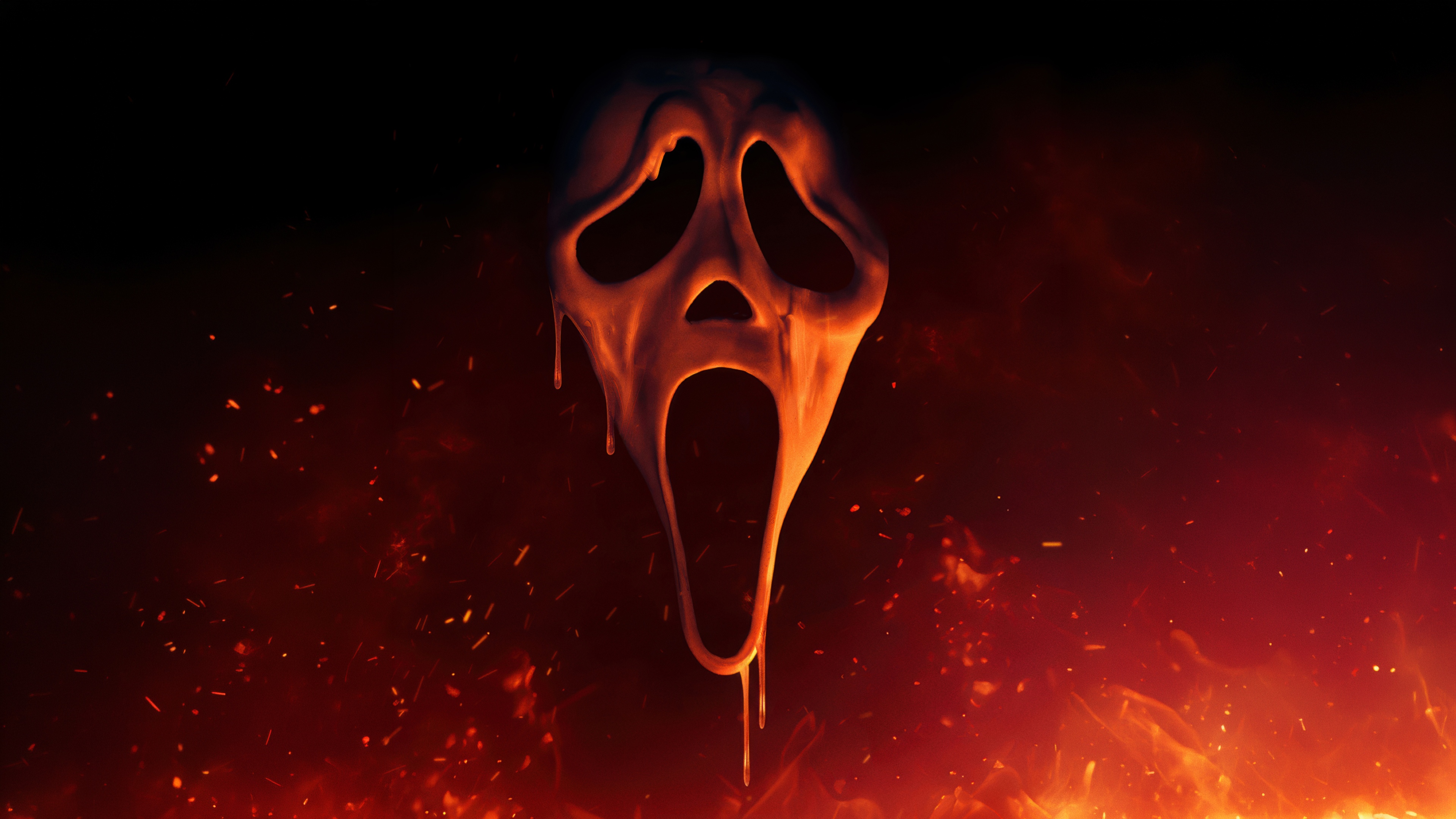The iconic Ghostface mask from the Scream franchise surrounded by realistic fire and embers.