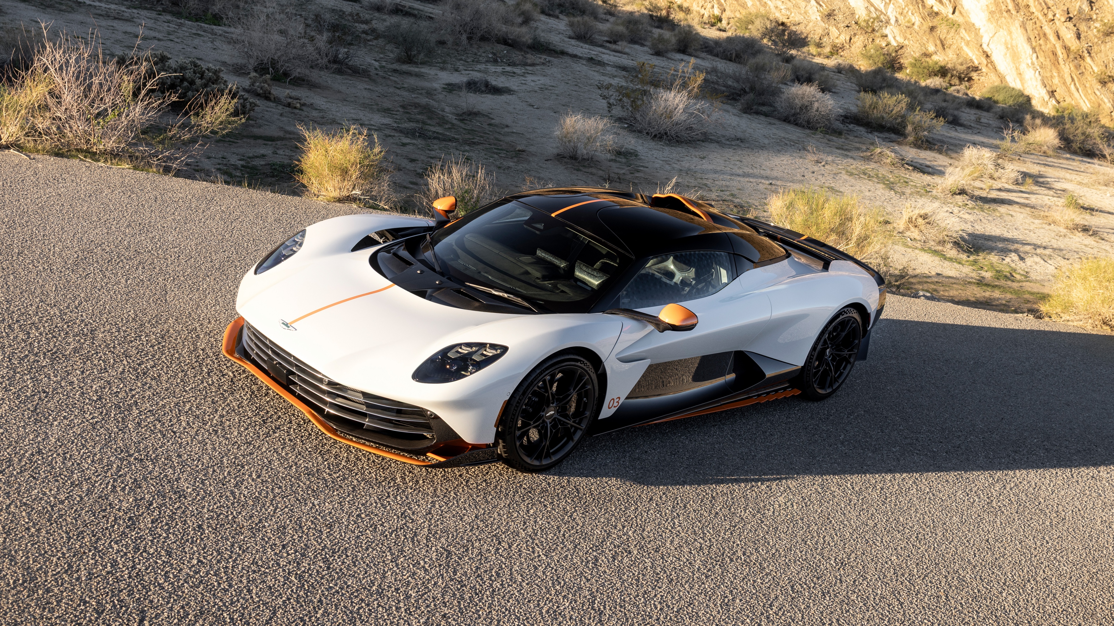 A sleek and aerodynamic white 2025 Aston Martin Valhalla plug-in hybrid supercar.