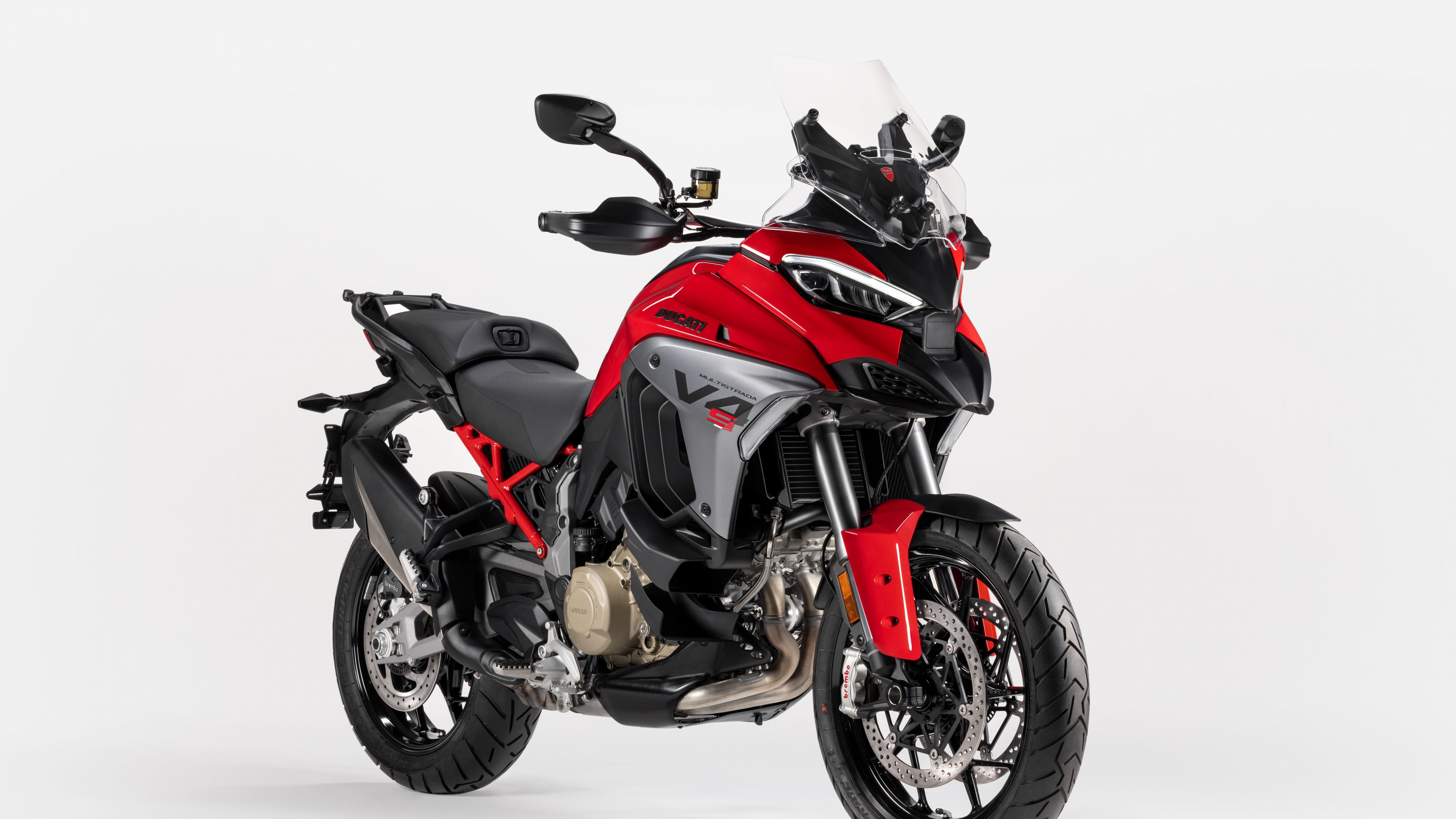 A 2025 Ducati Multistrada V4 S adventure motorcycle isolated on a white background.