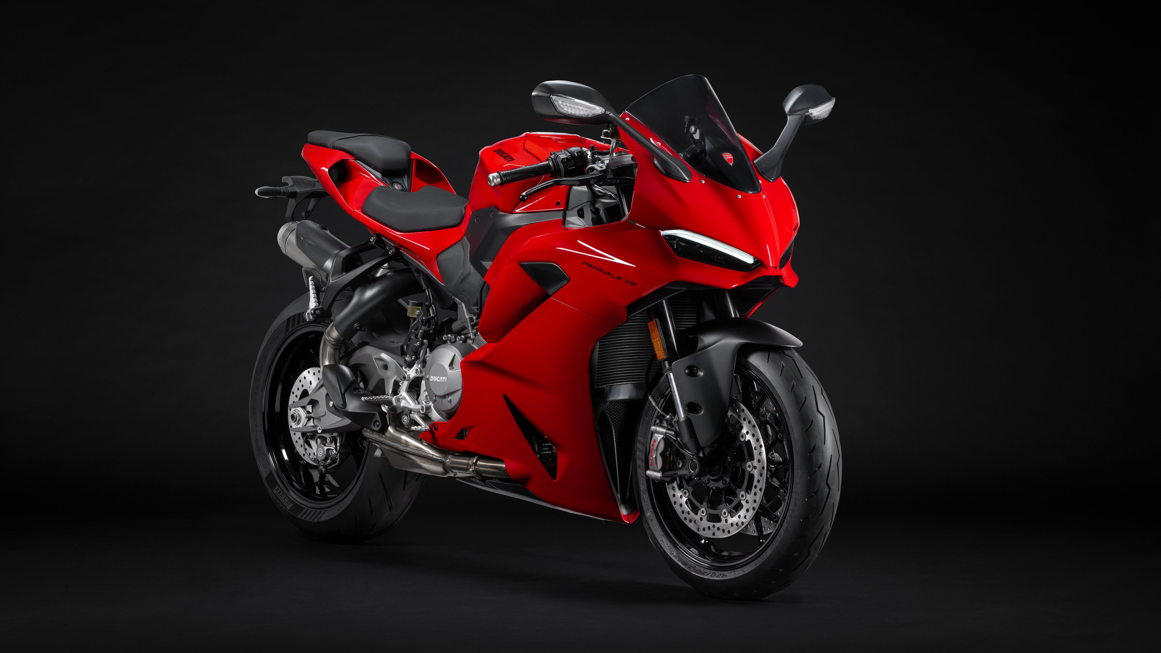 A highly detailed, cinematic close-up of the 2025 Ducati Panigale V2 motorcycle against a dark, moody background.