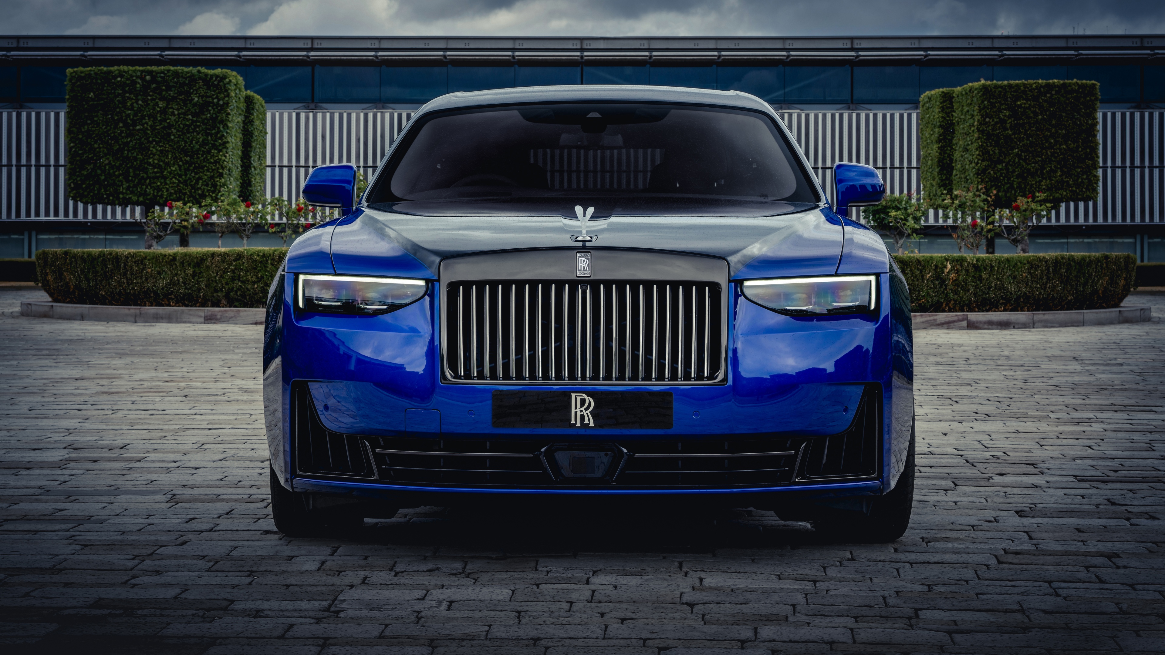 A sleek and polished 2025 Rolls-Royce Black Badge Ghost in high definition.