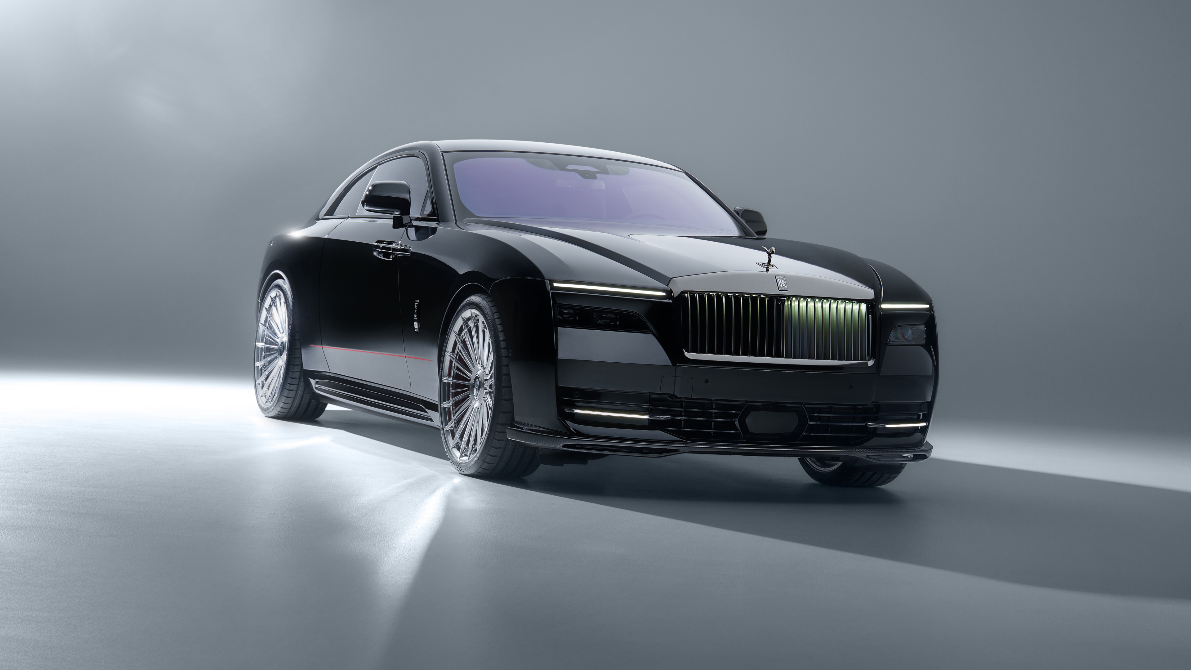 2025 Rolls-Royce Black Badge Spectre with SPOFEC widebody kit on a neutral grey studio background