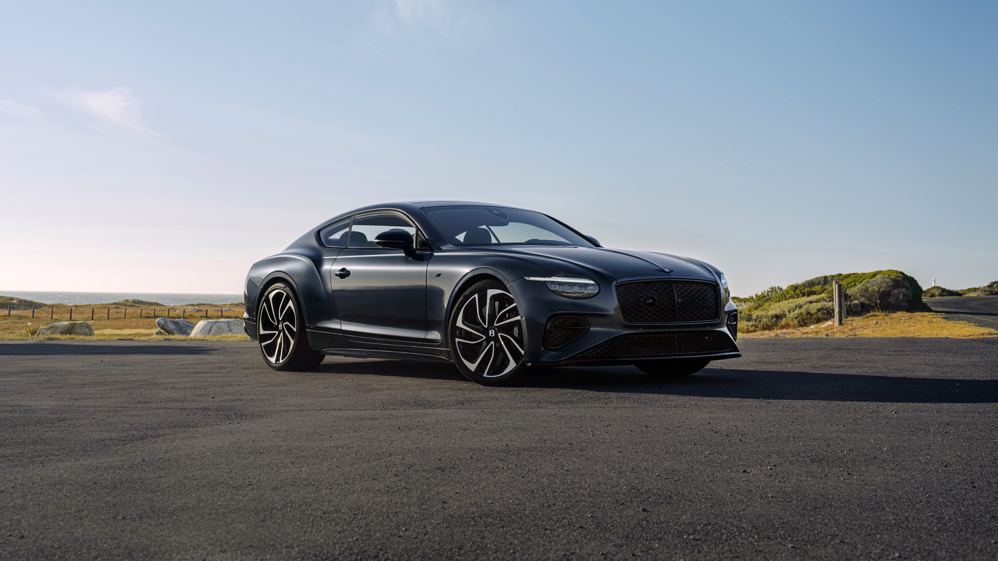 A high-resolution, cinematic view of the futuristic 2026 Bentley Continental GT S showcasing its premium metallic finish and elegant silhouette.