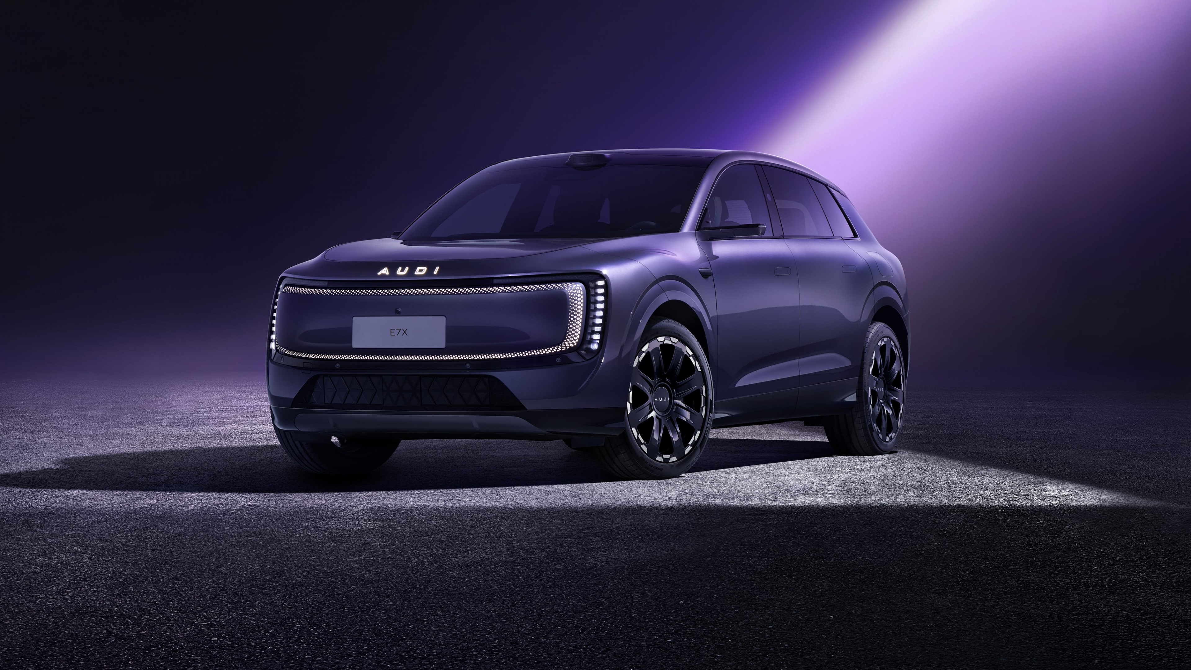 A sleek, futuristic electric SUV in a vibrant purple color with neon lighting accents and an aerodynamic body.