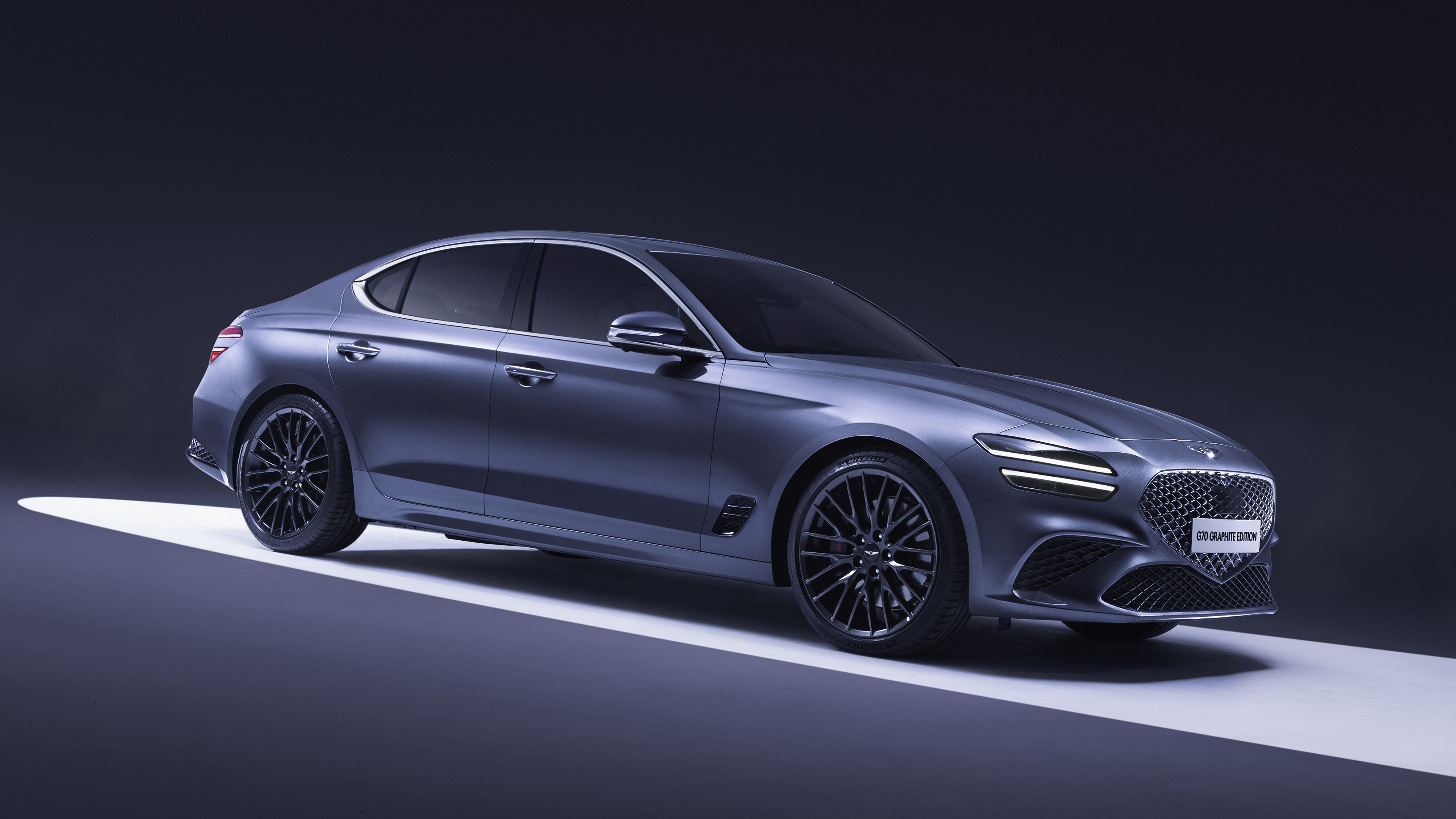 A high-end, futuristic 2026 Genesis G70 luxury sedan featuring modern LED lighting and a sleek metallic finish.