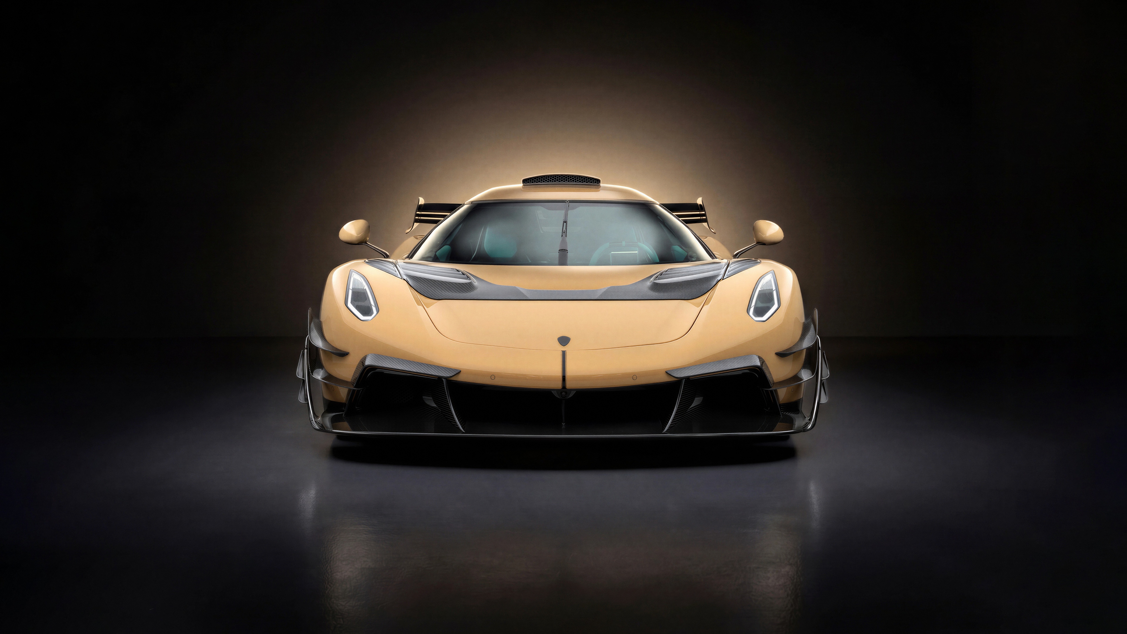 A dramatic, high-resolution shot of a modified 2026 Mansory Koenigsegg Jesko sports car in a dark, atmospheric setting.