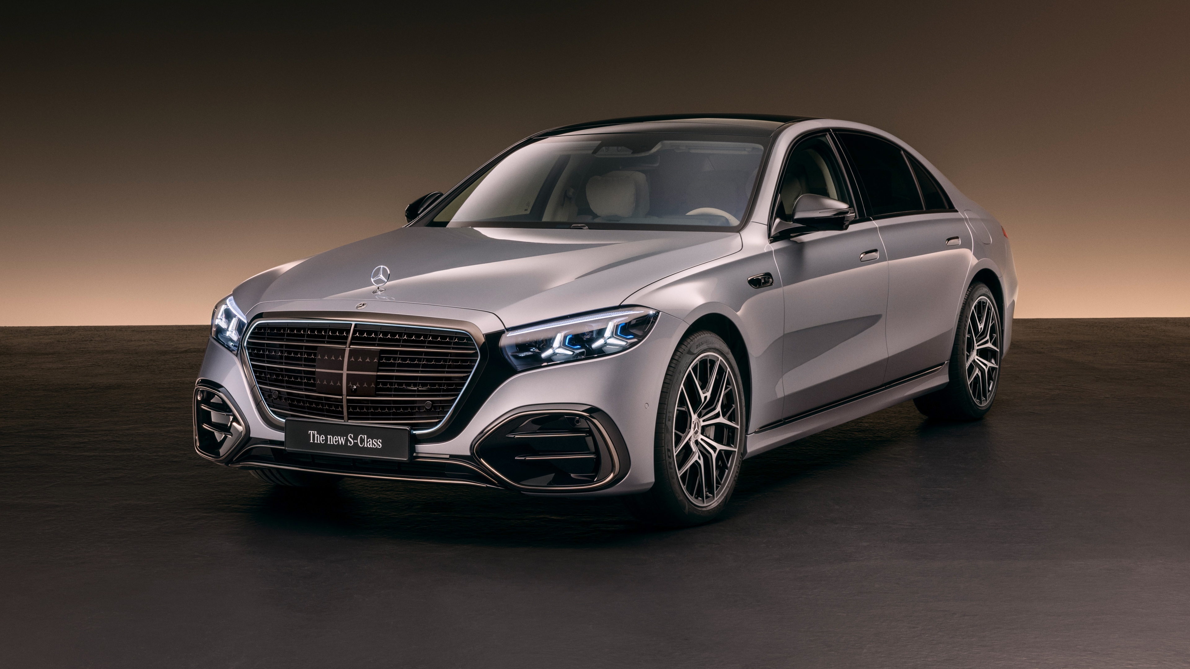 A sleek and futuristic 2026 Mercedes-Benz S 580 e 4MATIC luxury electric sedan featuring a high-gloss finish and modern automotive design.