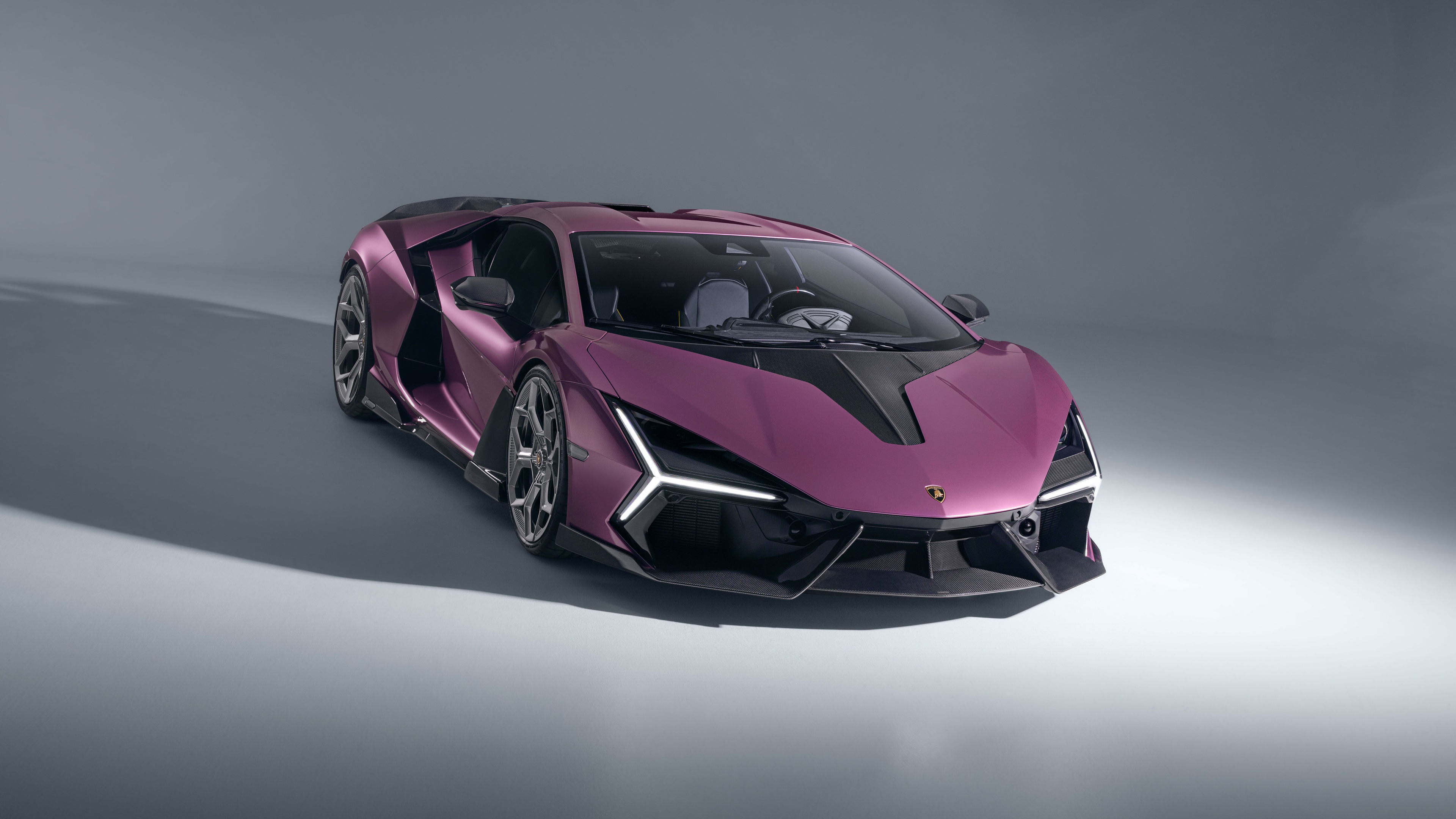 A high-resolution close-up of a customized Novitec Lamborghini Revuelto featuring aggressive body styling and premium carbon fiber components.