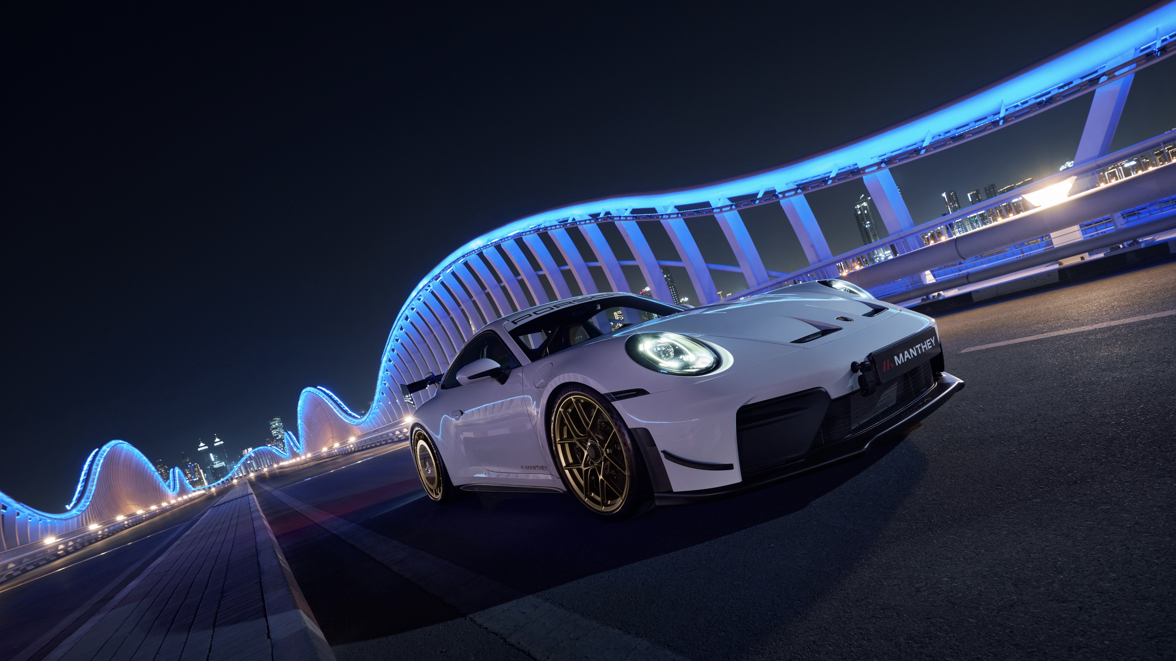 High-resolution detail of a 2026 Porsche 911 GT3 featuring the Manthey Performance Kit aerodynamic bodywork.