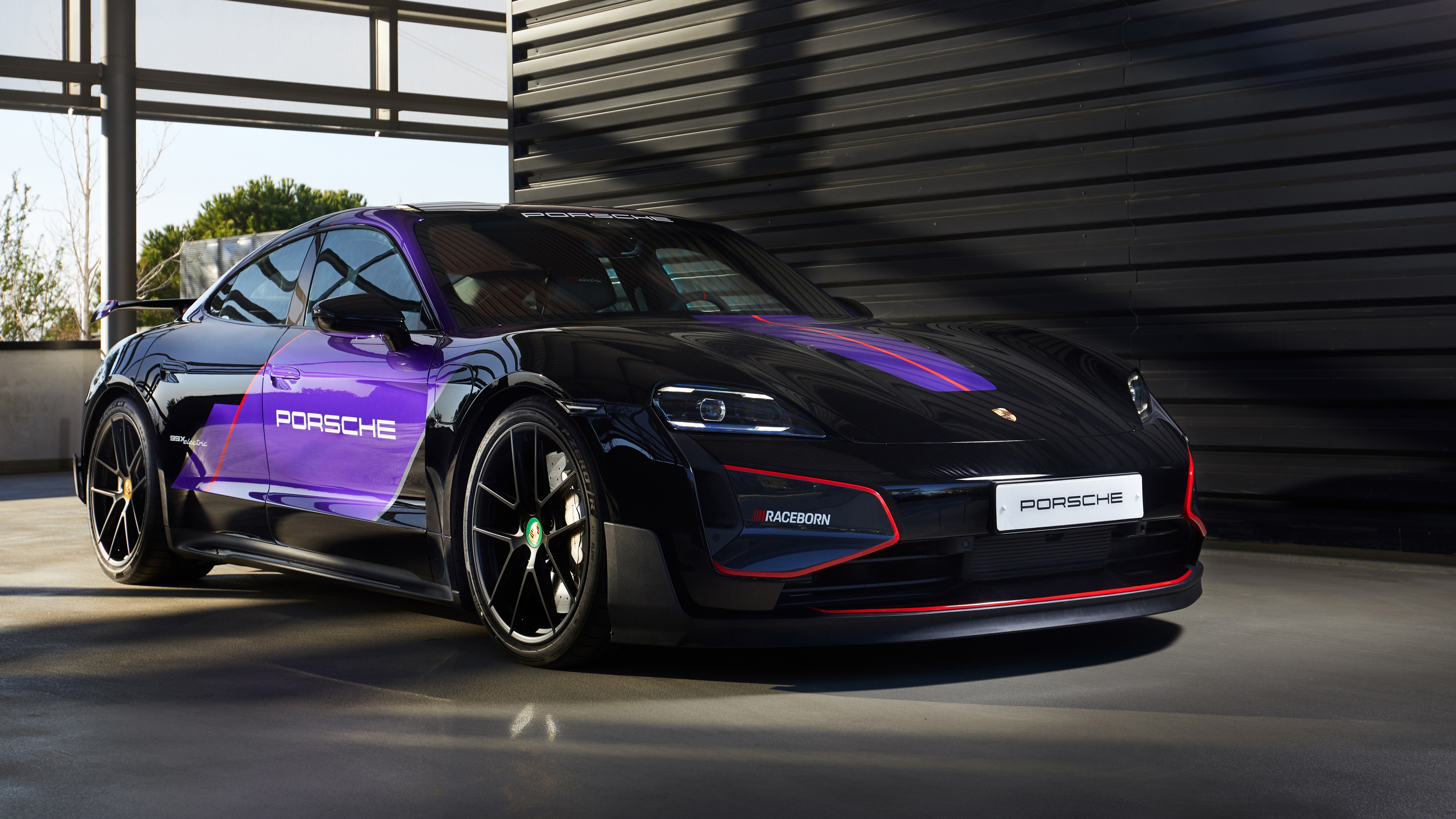 A sleek and powerful 2026 Porsche Taycan Turbo GT electric race car with advanced aerodynamic features.