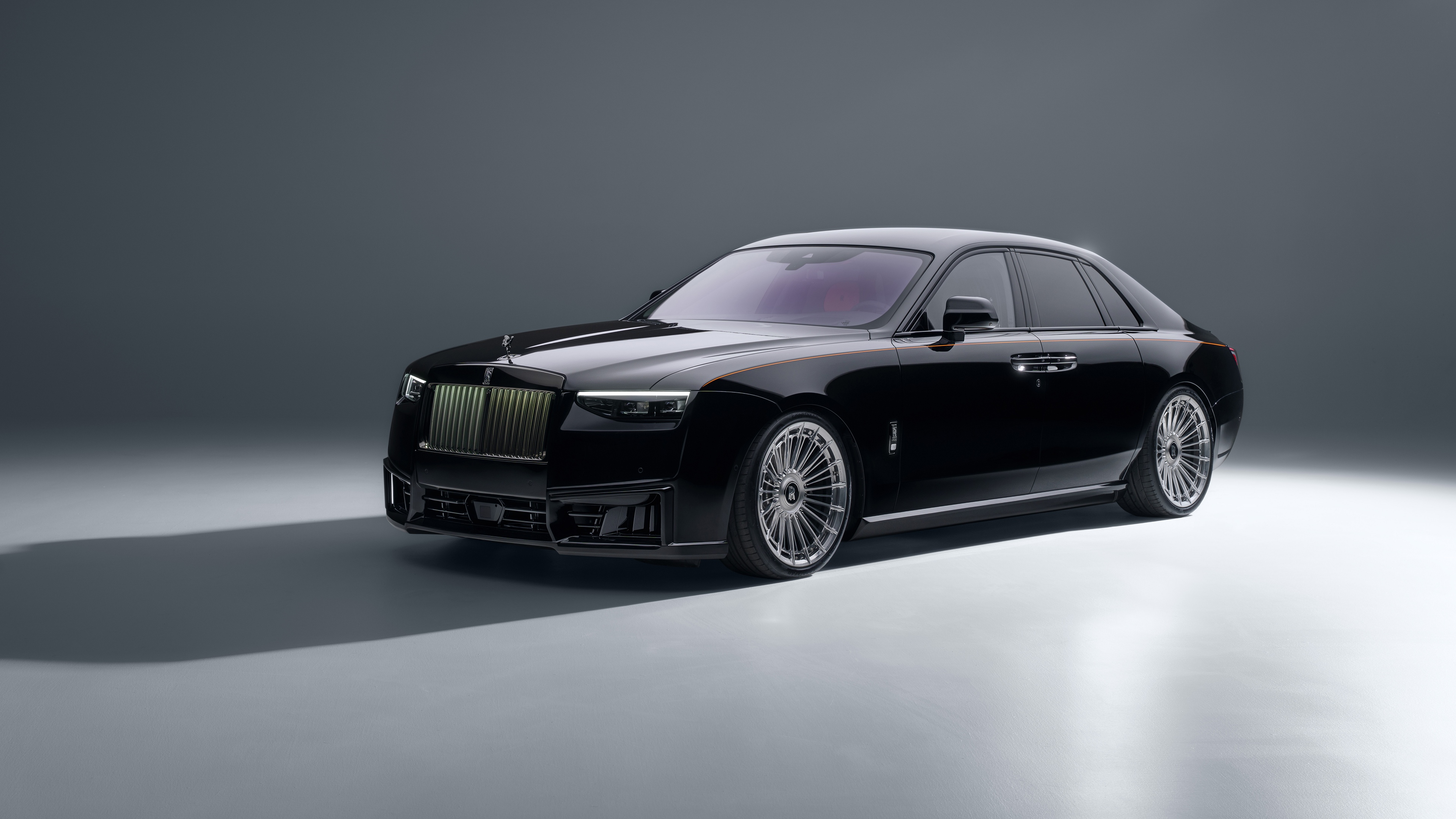 A high-resolution, detailed view of the 2026 Rolls-Royce Black Badge Ghost in a premium dark finish.