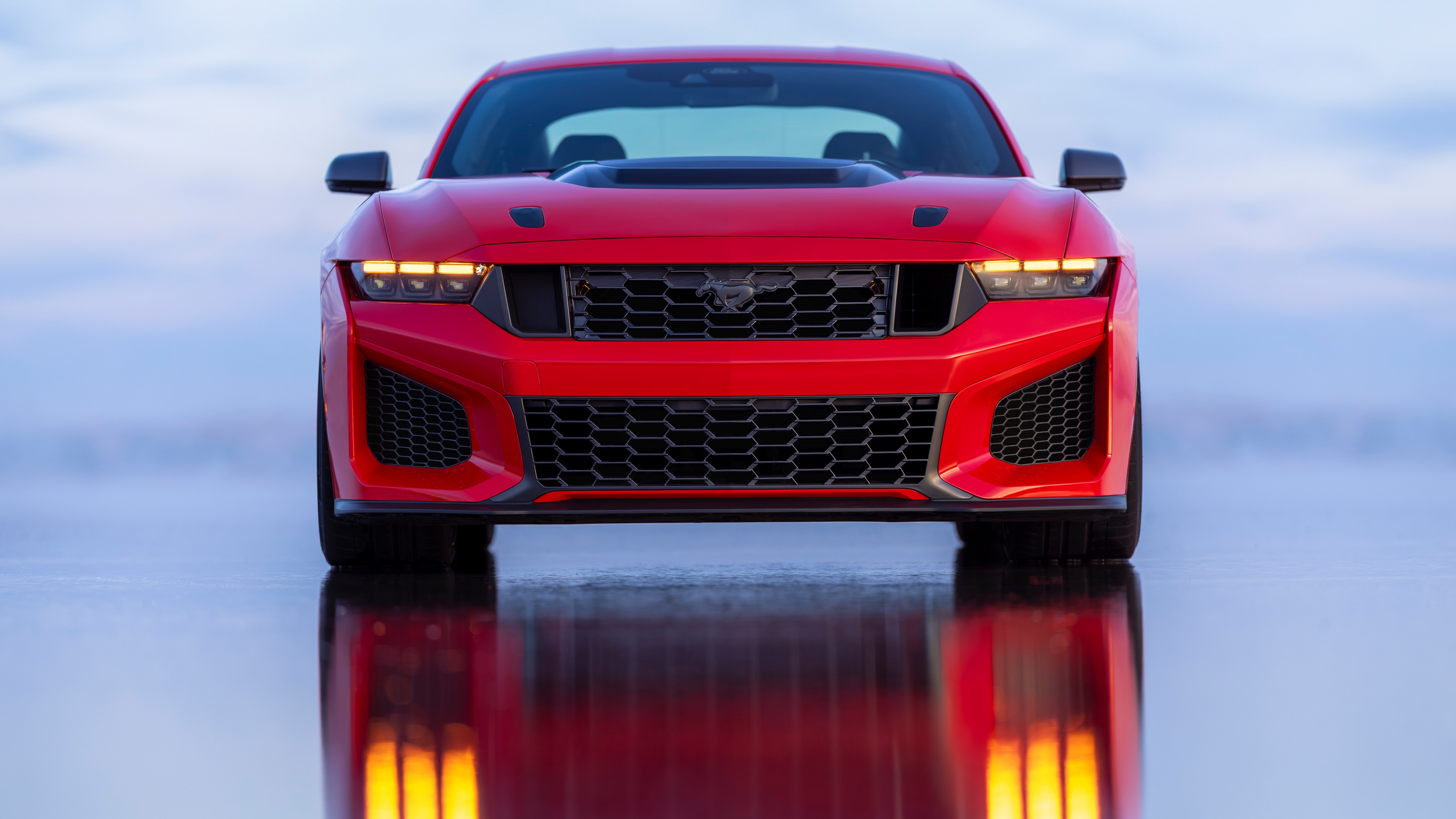 A high-detail, close-up view of a vibrant red 2027 Ford Mustang Dark Horse SC showcasing its aerodynamic design.