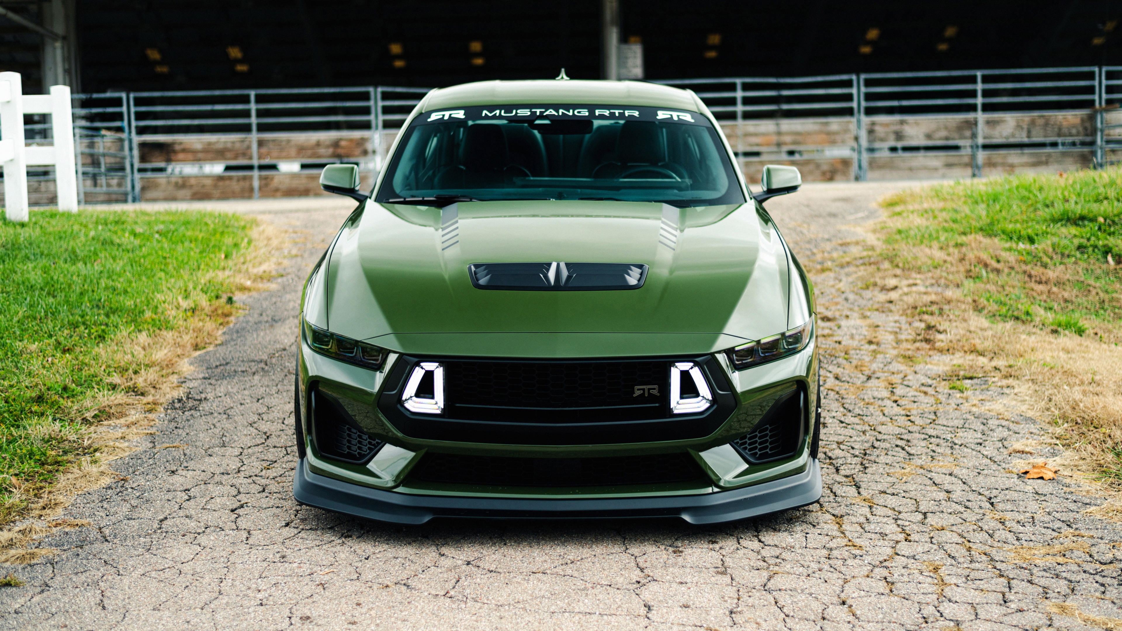 A high-resolution close-up of a sleek, metallic performance sports car with aerodynamic features and a glossy finish.