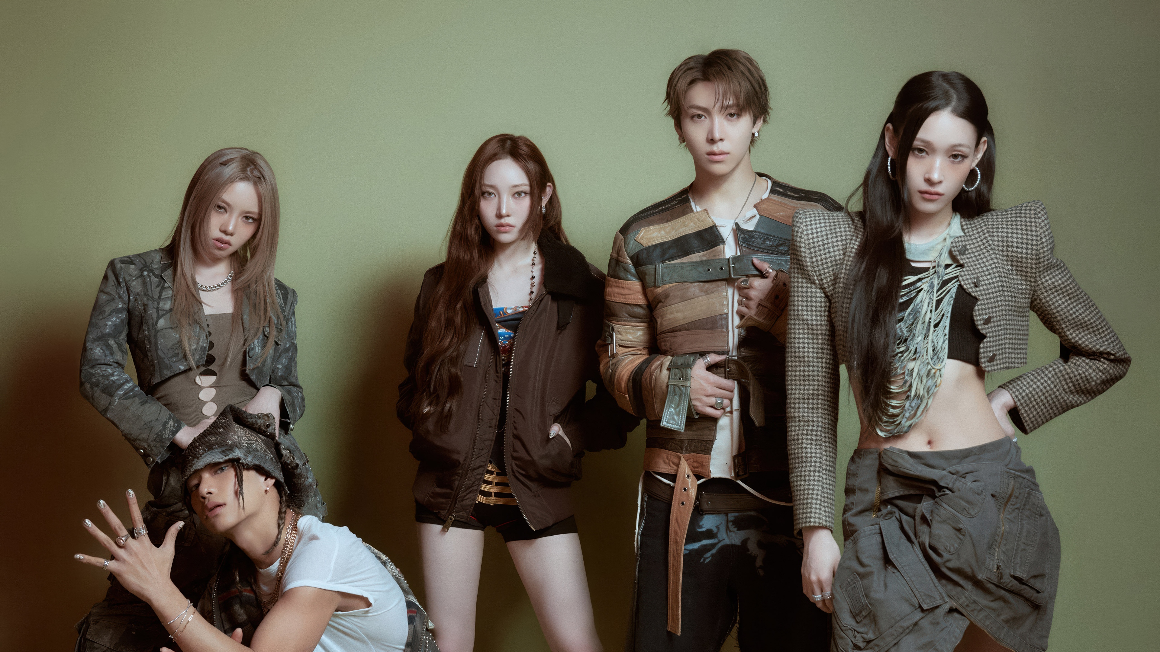 Vertical studio portrait of K-pop group ALLDAY PROJECT members Youngseo, Annie, Bailey, Tarzzan, and Woochan.