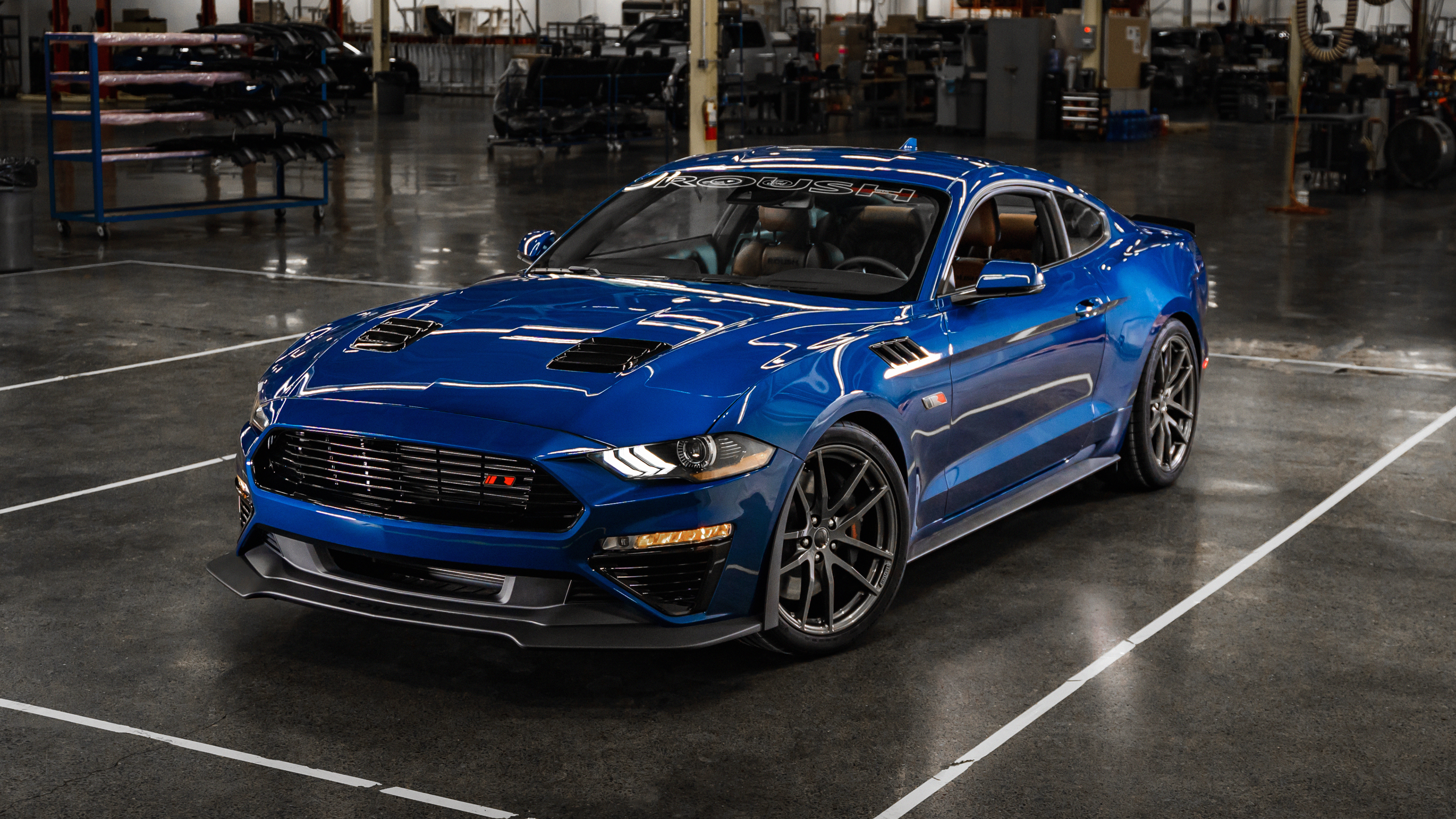 A high-performance blue Ford Mustang automobile.