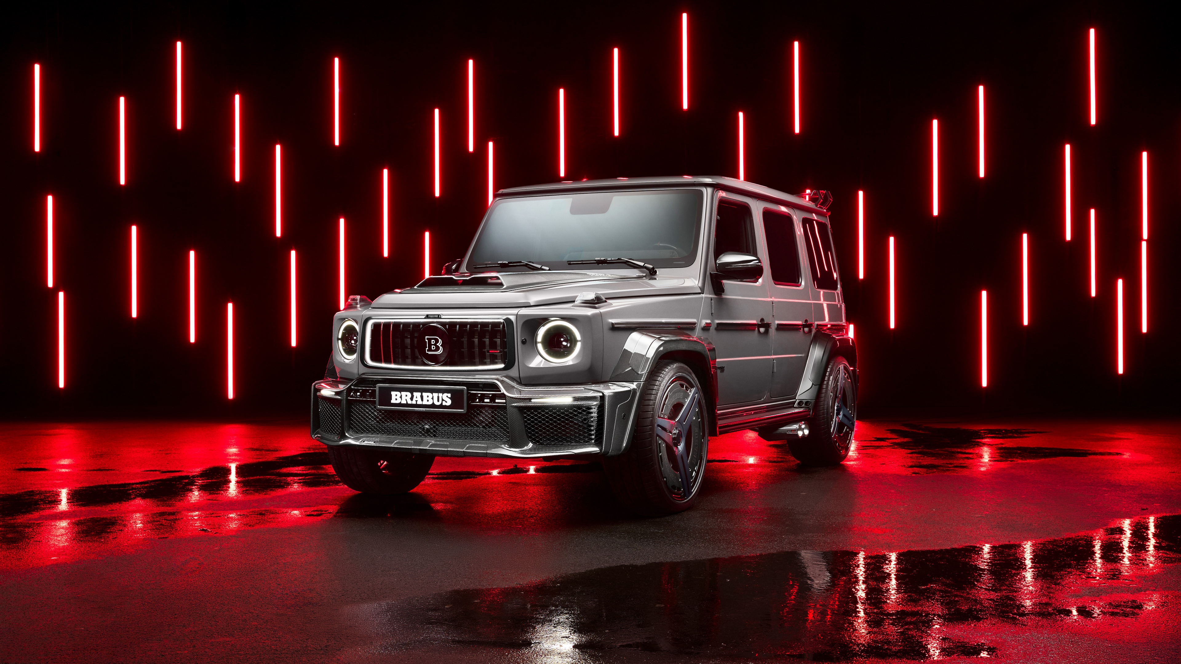 A luxurious Brabus 900 Mercedes-AMG G 63 super sports SUV featuring a vibrant red aesthetic and glowing LED lighting.