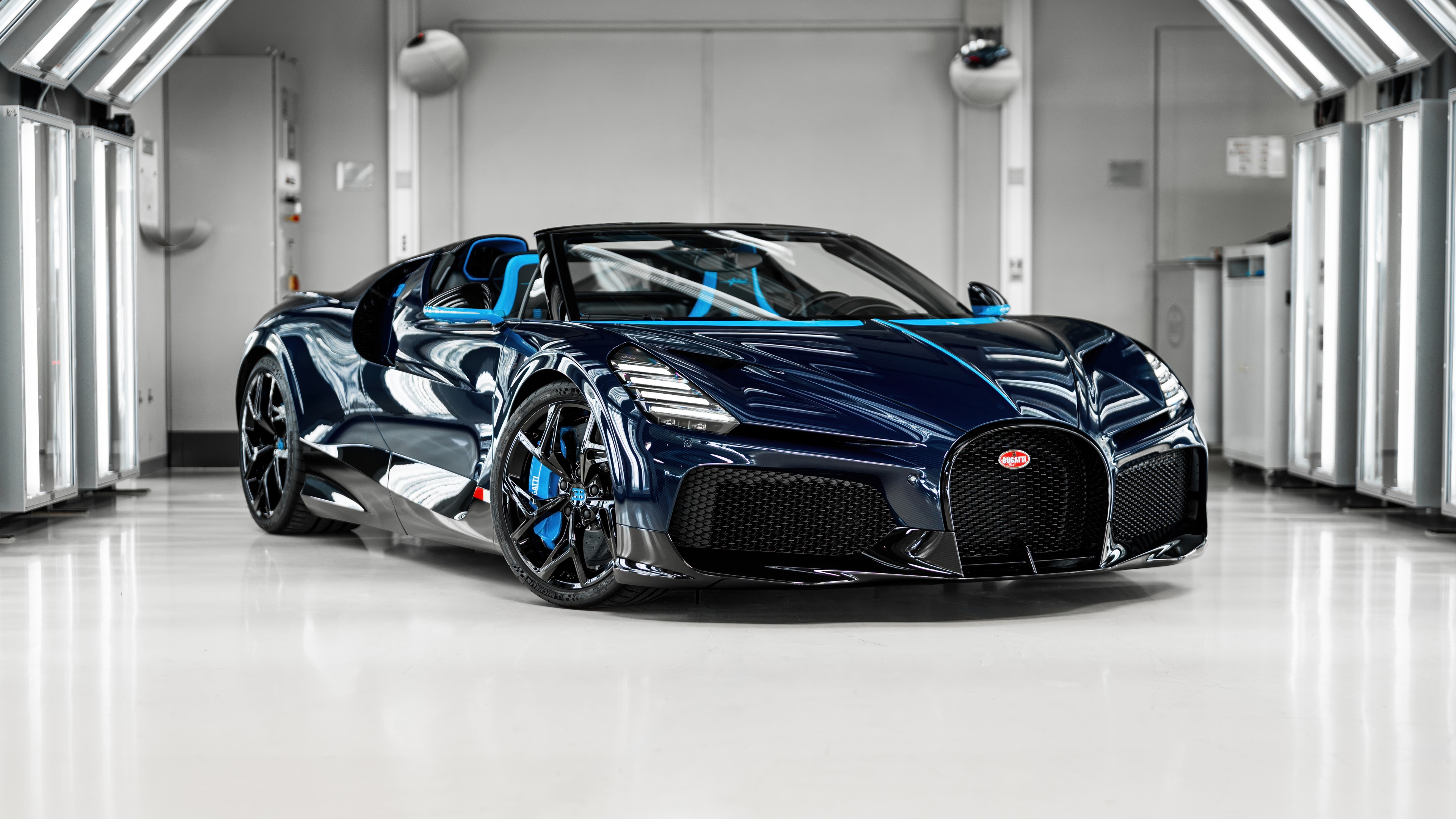 A high-performance Bugatti W16 Mistral hypercar featuring a premium blue and black exterior.