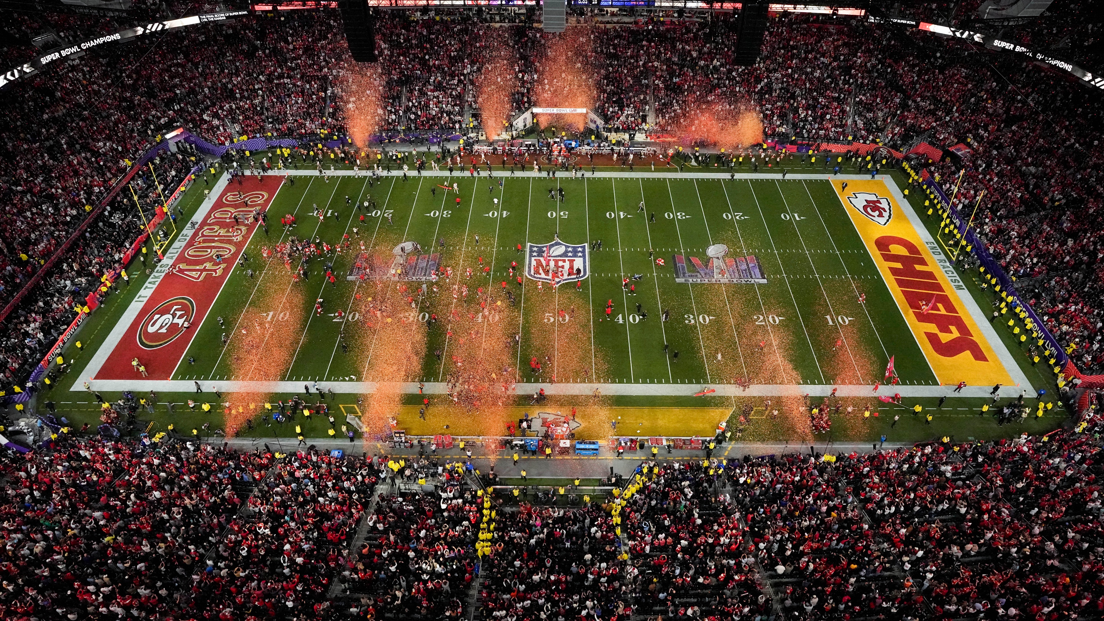 A high-detail cinematic shot of players competing in an American football game during the 2024 Super Bowl.