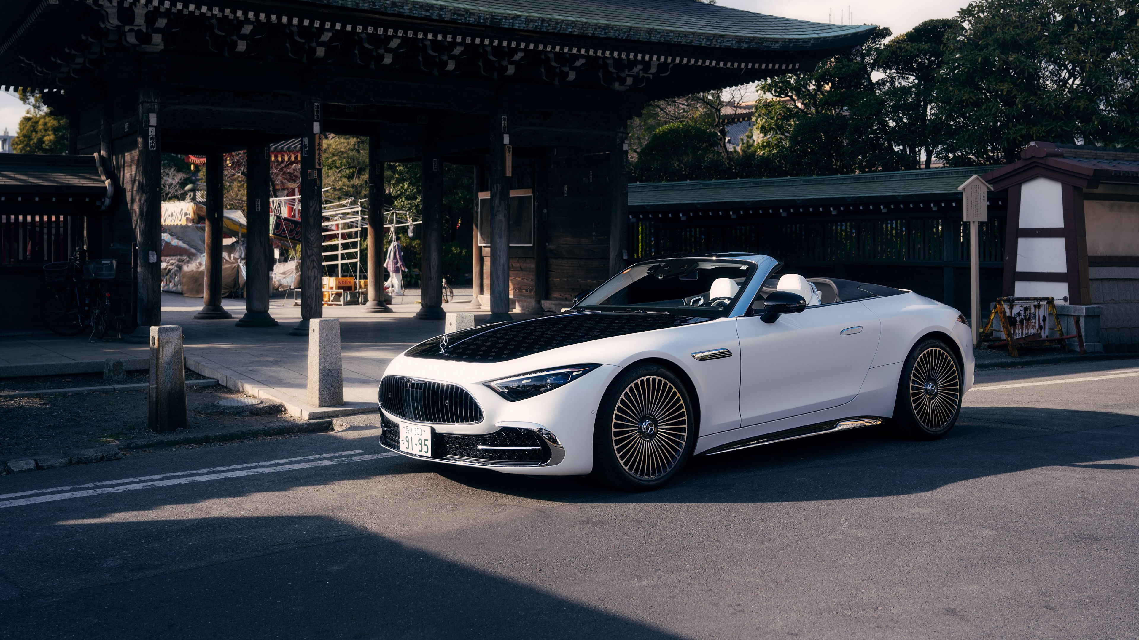 A luxurious Mercedes-Maybach SL 680 parked in a scenic outdoor environment.