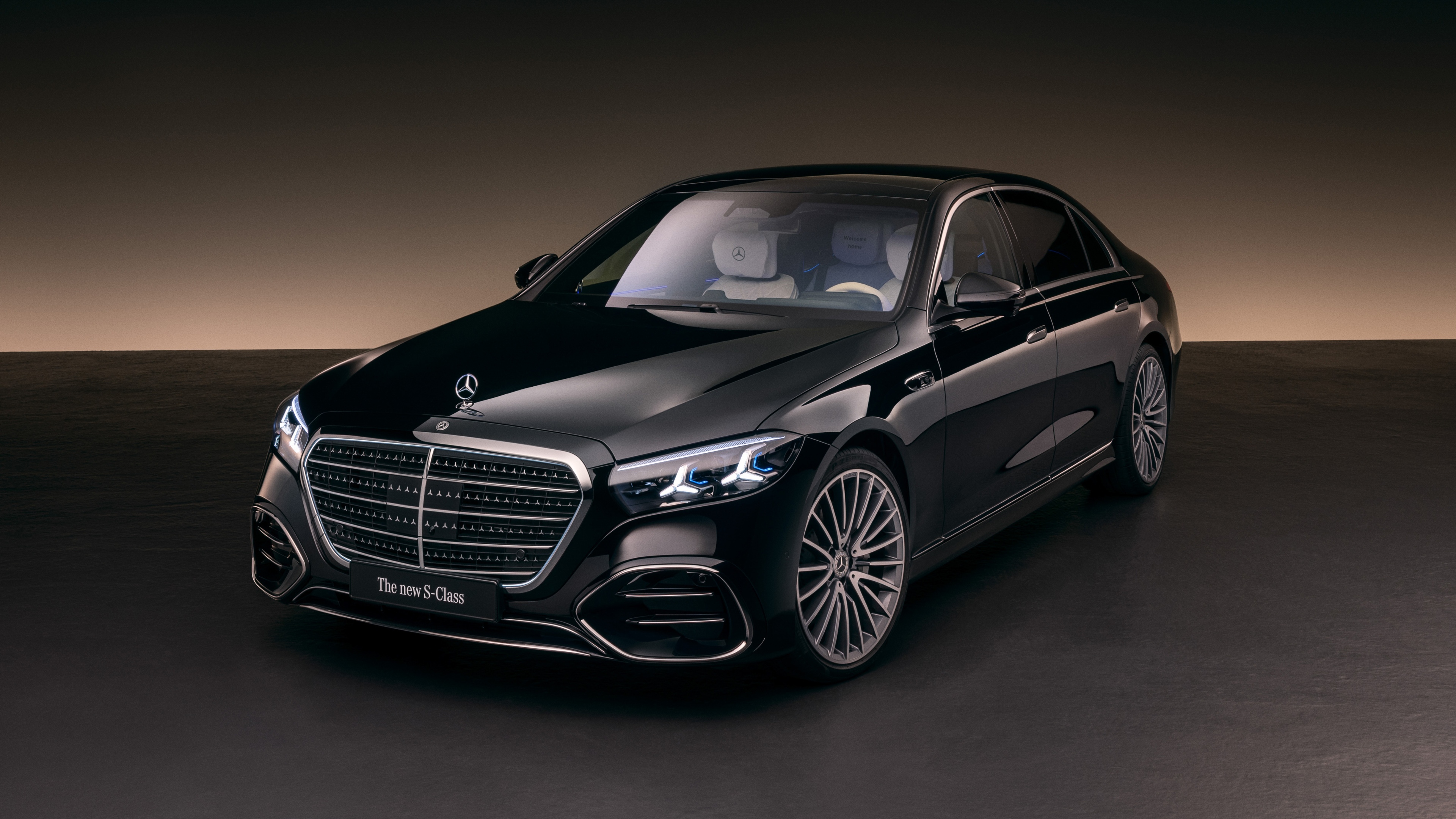 A lineup of premium black luxury cars with futuristic designs and polished finishes, representing 2026 automotive trends.
