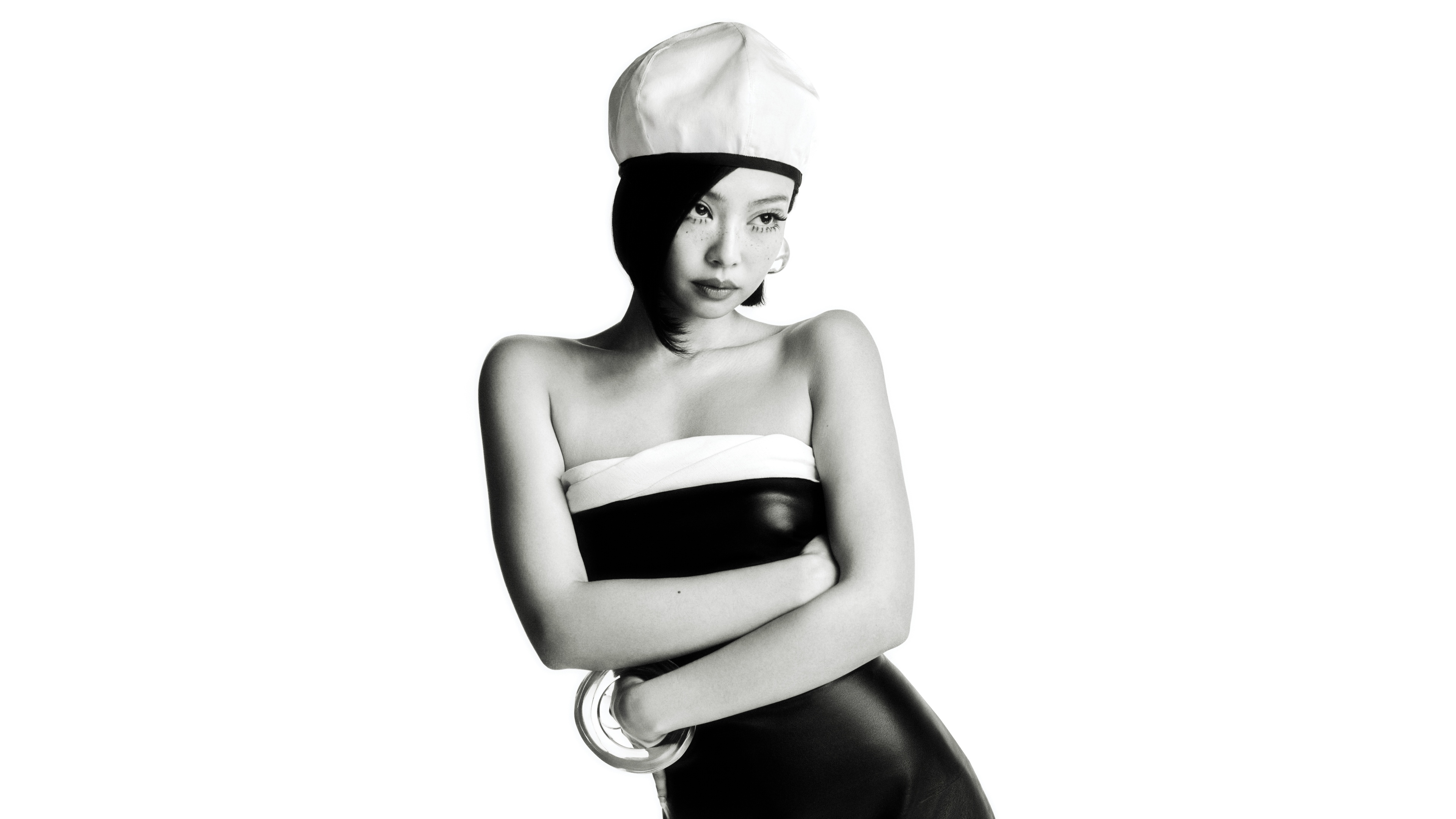 A high-detail monochrome fashion portrait of Jennie Kim from BLACKPINK against a clean white background.