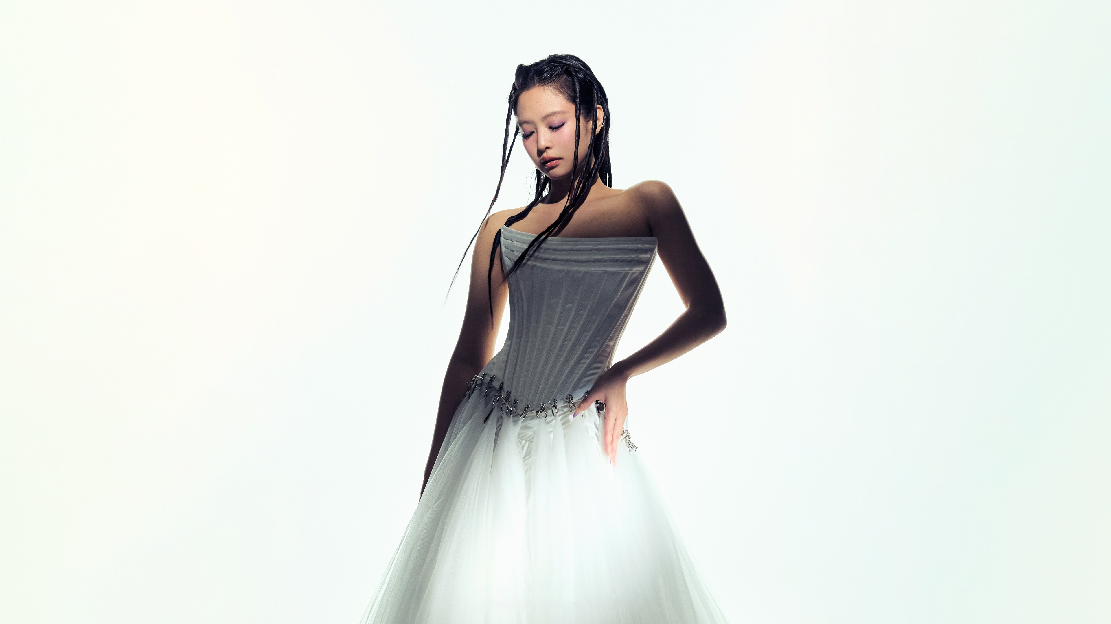 A high-definition, elegant portrait of Jennie Kim from BLACKPINK against a clean white background.