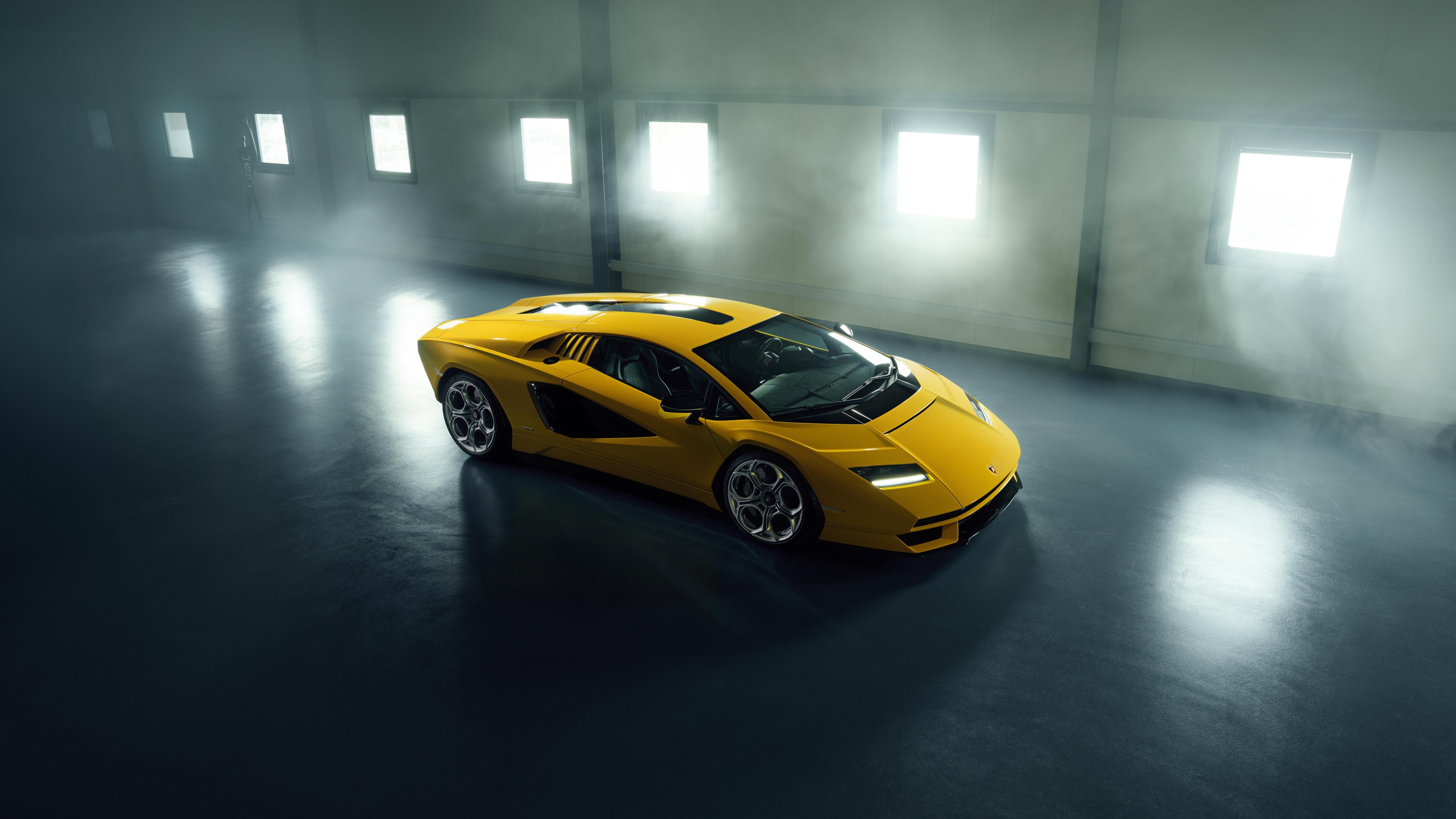 A highly detailed view of a Lamborghini Countach LPI 800-4 parked inside a luxury-style garage.