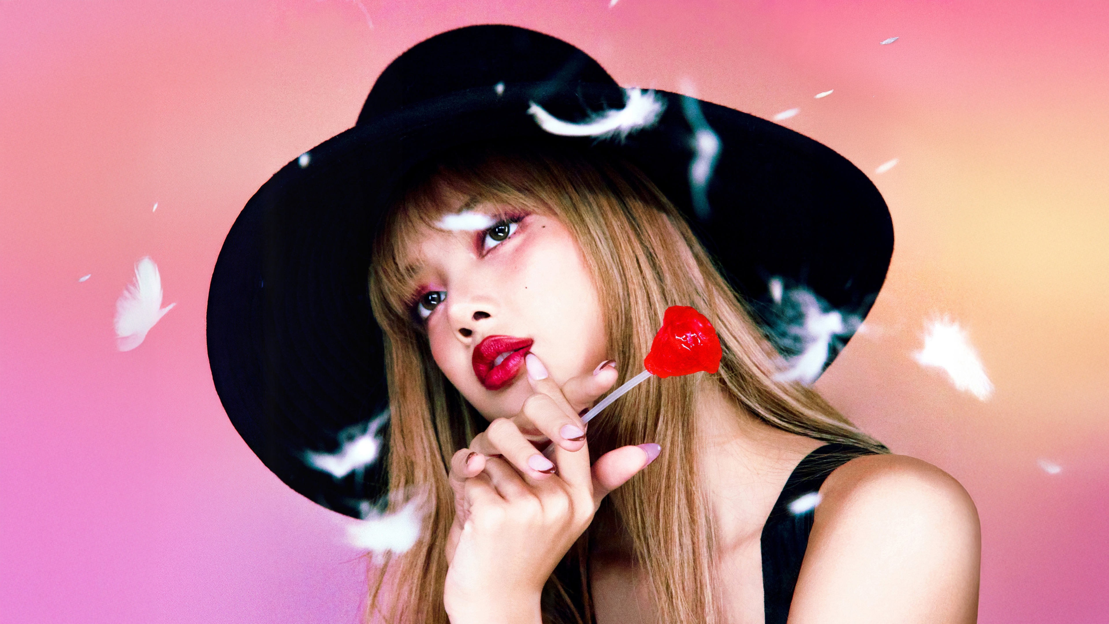 A stunning portrait of Lisa from BLACKPINK holding a red rose against a soft gradient background.