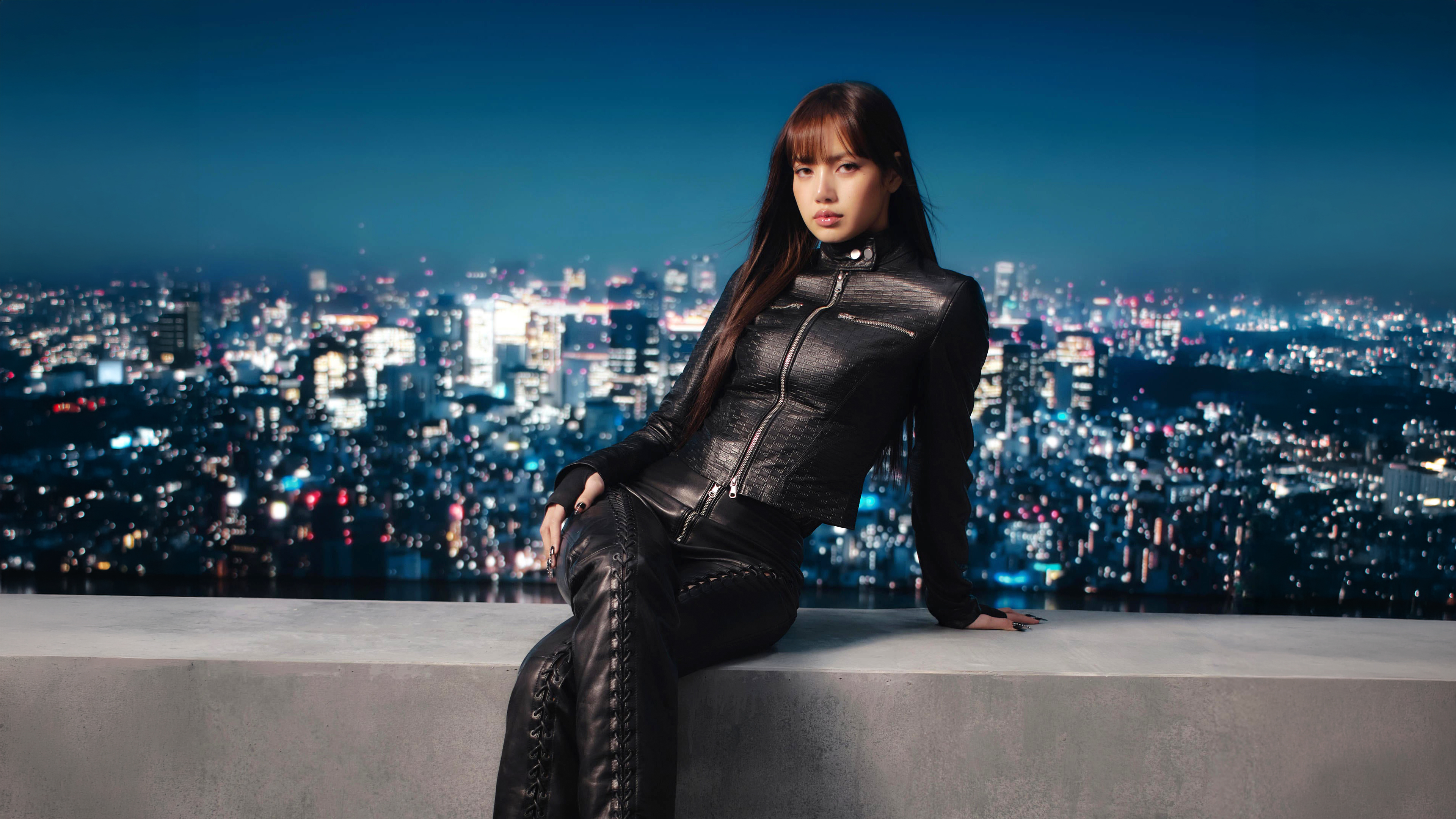 A portrait of a woman named Lisa dressed in a stylish black western-style dress.
