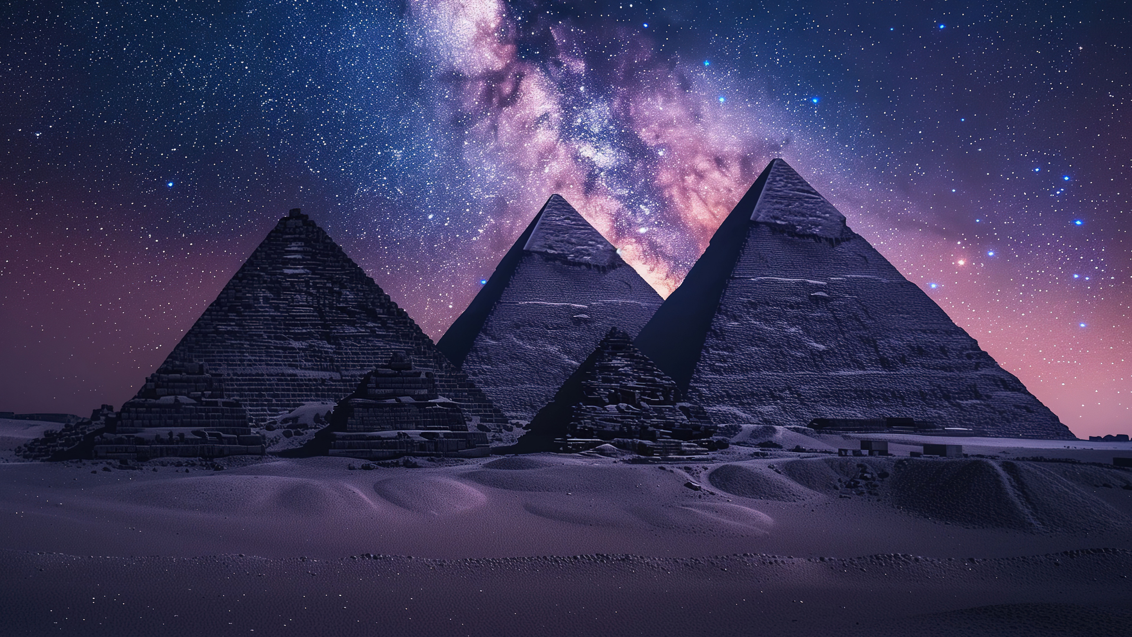 The Great Pyramids of Giza beneath a brilliant Milky Way galaxy and starry night sky