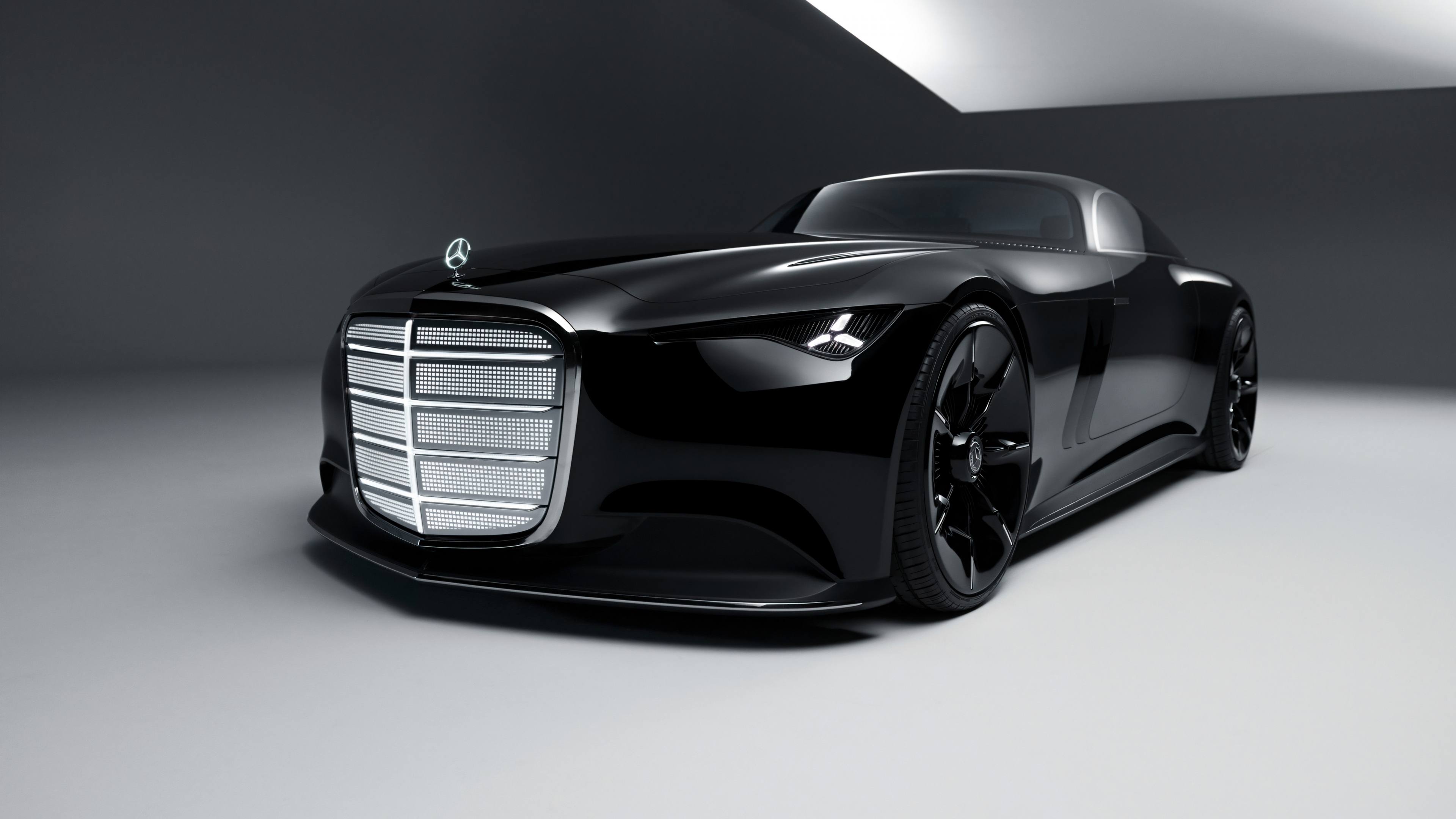 A sleek, black Mercedes-Benz Vision Iconic concept car showcasing futuristic automotive design.