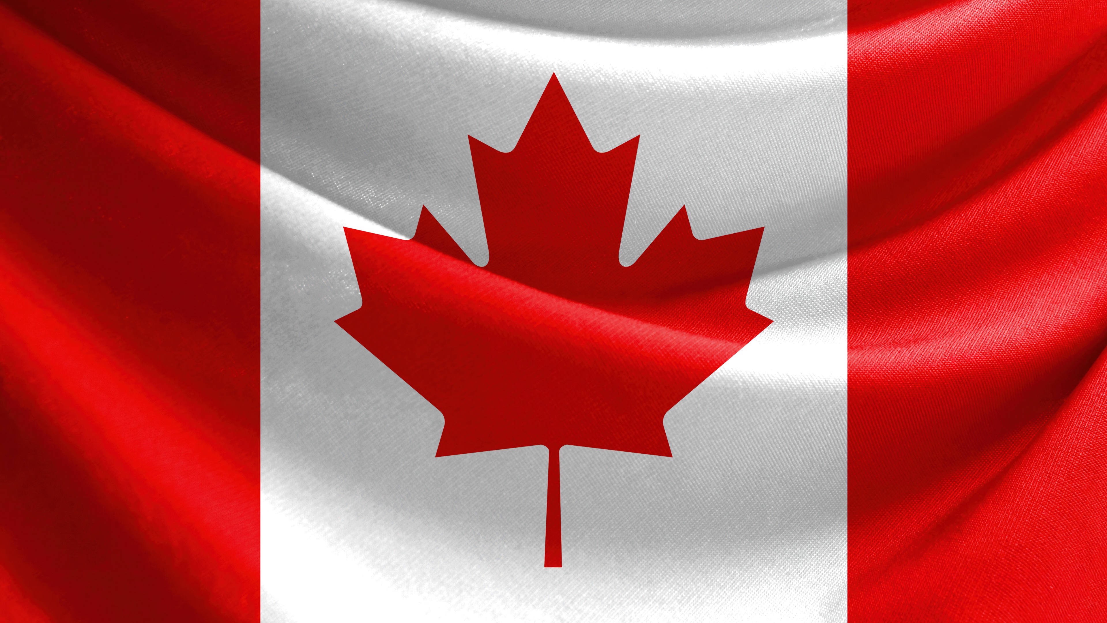The national flag of Canada featuring a prominent red maple leaf centered between two red vertical bars.