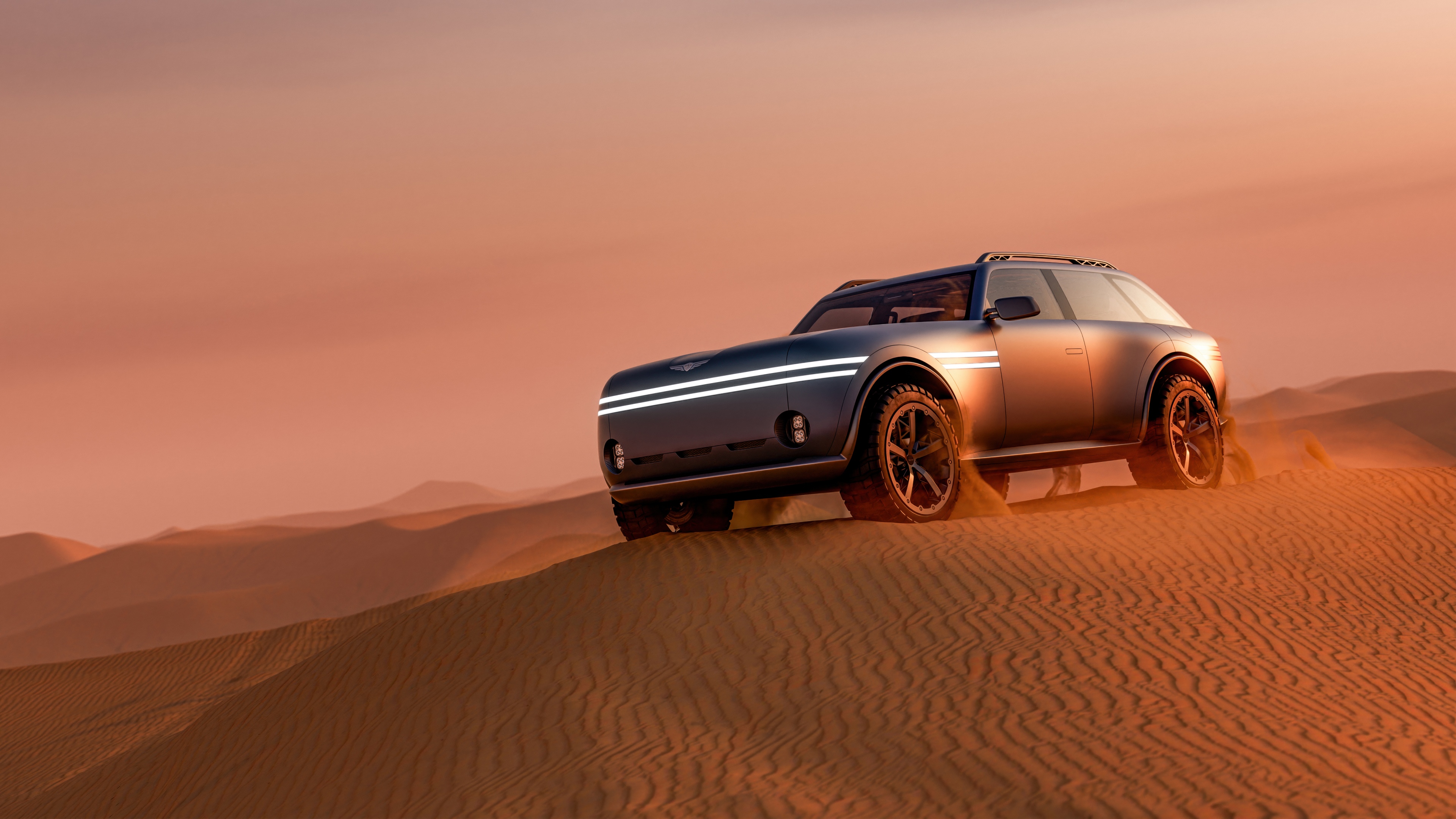 A cybernetic explorer in advanced metallic armor walking across vast golden desert dunes under a bright sun.